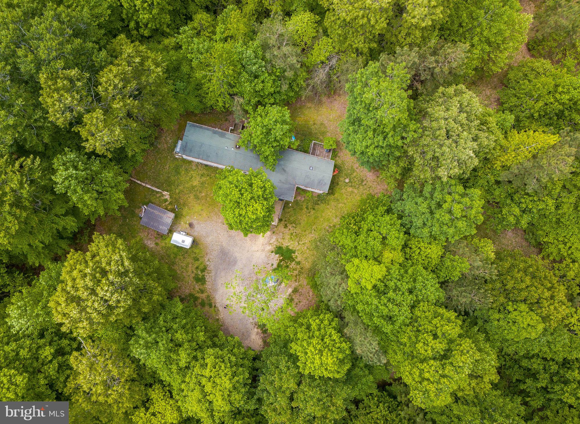 **SELLER IS OFFERING $5,000 TOWARD MOBILE HOME REMOVAL OR CLOSING HELP WITH ACCEPTABLE OFFER***  LOVELY WOODED 5 ACRE LOT WITH WELL AND SEPTIC IN PLACE.  CURRENTLY THERE IS A MOBILE HOME ON THE PROPERTY THAT IS BEING SOLD AS-IS.