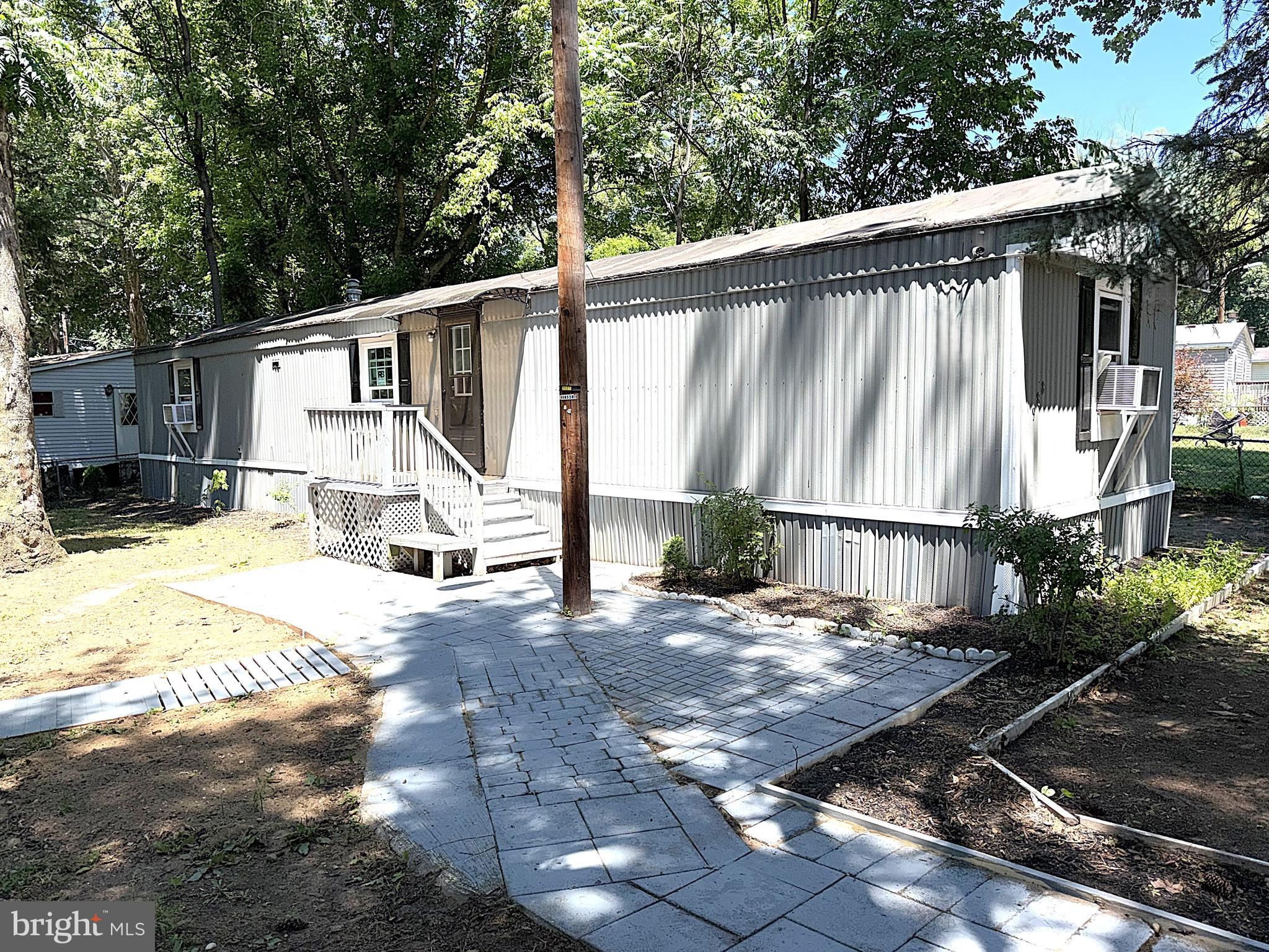 Very Nice Single Wide on Big Fenced Lot! Over 900 square feet with 3 Bedrooms and 2 Full Bathrooms. Open Floor Plan with many recent updates including New Furnace, Luxury Vinyl Plank Flooring throughout, Painted Kitchen Cabinets and Breakfast Bar with Ceramic Countertop, Stainless Steel Appliances, Light Fixtures, Bathroom Fixtures, and New Paint throughout. Inside Features Large Living Room and Primary Bedroom with Private Bathroom. Enjoy your time outside in your Big Fenced Yard with a Deck, Paver Patio and Secure Storage Shed. Close to Schools, Parks, Shopping and Restaurants. Easy access to Rt 4 and just 20 minutes to Andrews AFB.