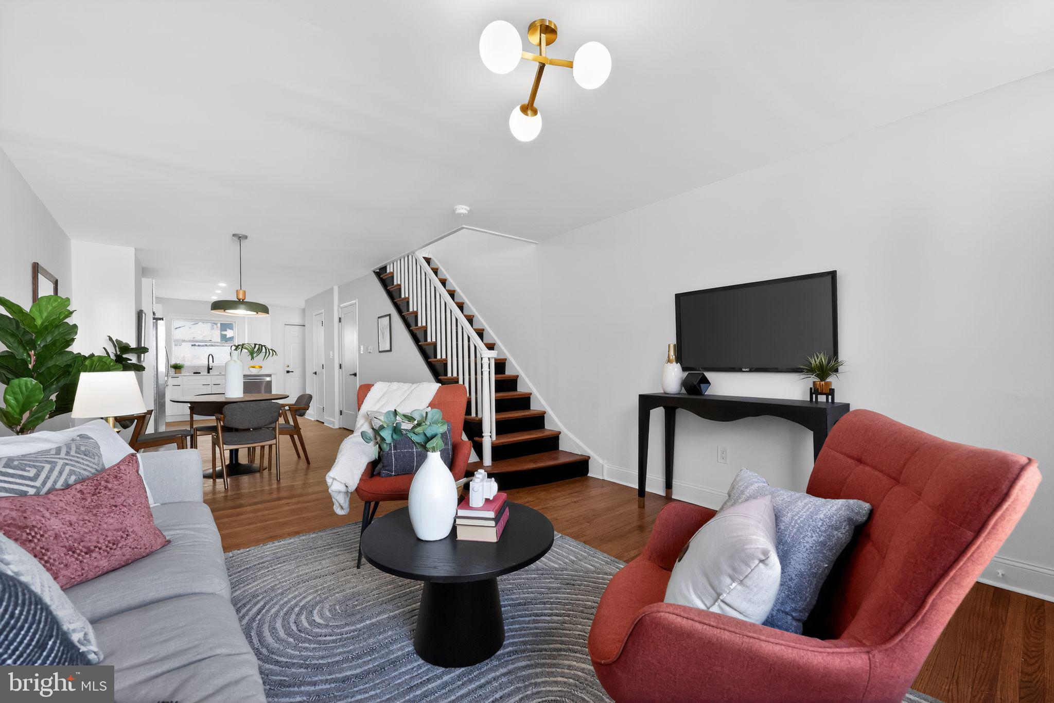 Welcome to this beautifully renovated 3-bedroom, 1.5-bath rowhome in the heart of Passyunk Square. This home perfectly blends old-world charm with modern updates, featuring refinished original hardwood floors alongside quartz countertops, a tile backsplash, stainless steel appliances, recessed lighting, and stylish fixtures throughout. A convenient half bath has been added to the first floor for everyday ease. Upstairs, you’ll find three generously sized bedrooms offering comfortable living space and flexibility for a variety of needs. The hallway bathroom has been tastefully updated with modern tile, a sleek vanity, and contemporary light fixtures. The exterior has been freshly updated and painted, and the private, walled rear patio offers the perfect space for grilling and outdoor entertaining. Located just one block from local favorites like Cosmi’s Deli, Tesiny, Termini Brothers Bakery, and other neighborhood staples, you’re also just a short walk to Passyunk Avenue’s vibrant shopping and dining scene, as well as the Broad Street subway line for easy commuting. Don’t miss the opportunity to own a move-in-ready home in one of Philadelphia’s most sought-after neighborhoods! The listing agent has an equitable interest in this property.