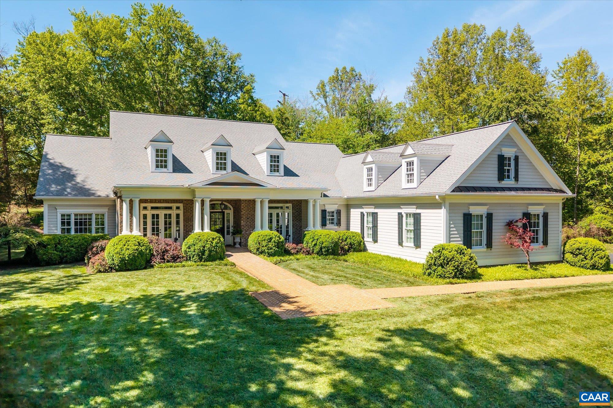 Proffit Ridge is a beautifully maintained community of distinctive homes, where pride of ownership is evident at every turn. The neighborhood offers a refined yet welcoming feel, with manicured landscapes and timeless architectural character throughout. This custom residence showcases exceptional craftsmanship and thoughtful design. Sited on three acres on a quiet cul-de-sac, the home was designed for one-level living, featuring a gracious primary suite, many versatile living spaces, and three additional bedrooms, all on the main floor. The open-concept living area is an entertainer?s dream, highlighted by an elegant entry, a great room with a coffered ceiling, built-ins, and a gas fireplace, and a regal kitchen complete with gas cooking and high-end finishes. The terrace level, recently finished by the current owner, includes a fifth bedroom, full bath, theater, gym, game room, and abundant storage. Outdoor living is equally impressive, featuring a covered porch, hot tub, and fire pit, great for relaxing year-round. A three-car garage adds convenience and functionality. Come see this premier Albemarle County home, located 15 minutes from UVA and seven minutes from the airport, with easy access to the growing 29 North corridor.,Granite Counter,Painted Cabinets,Wood Cabinets,Fireplace in Den,Fireplace in Living Room