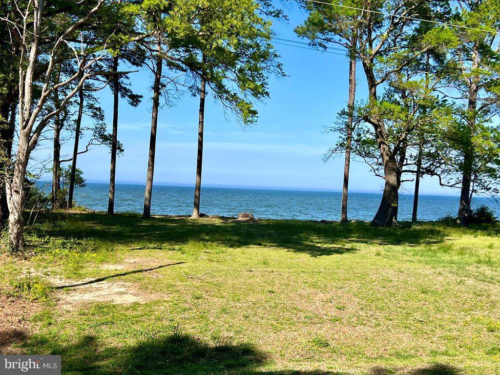 VIEWS, VIEWS, VIEWS ! It gets no better than this where you have Potomac/Bay and Beach views on one side and Lake/pond views on the other ! Also – it is like living Beach-Front with the private community beach just a few steps away ! Check out this parcel and the adjoining parcel (lot 164- priced at $80,000) to see why this might be an absolute Gem Location to Build your Dream Home ! In a wonderfully well kept neighborhood with impressive amenities.