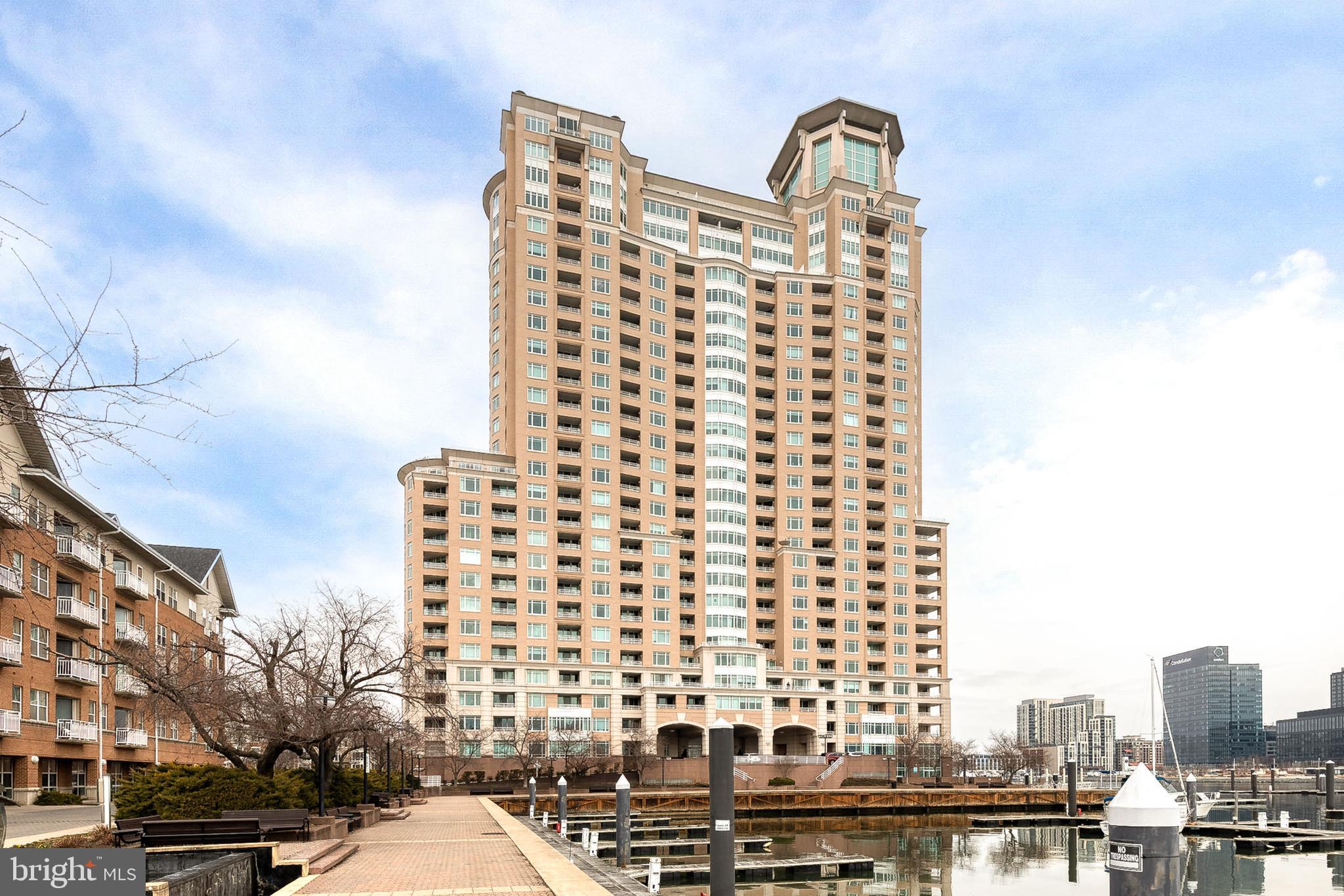 Exceptional Properties. Exceptional Clients. BACK ON THE MARKET! Buyer got cold feet, don't miss out on this opportunity to own a turn-key gem! Step into waterfront living at 100 Harborview Drive, Unit 305 — a sun-drenched 1‑bedroom, 1-bathroom retreat with sweeping harbor views that will greet you each morning. This beautiful, move-in ready condo features an updated bath, in-unit washer/dryer, and updated flooring throughout. The layout is perfect for effortless entertaining with incredible views from both the living room and bedroom. 

The building complements a city-focused lifestyle with thoughtful amenities: secure entry and on-site management, a well‑equipped fitness center, indoor and outdoor pools, garage parking — to name a few. Host larger celebrations in the building’s beautiful rentable event space — ideal for parties, family occasions, or work events with a waterfront backdrop. Steps from dining, shops, and transit, this condo blends city convenience with serene harbor charm. To top it off, this unit can be offered furnished for a truly turnkey experience.