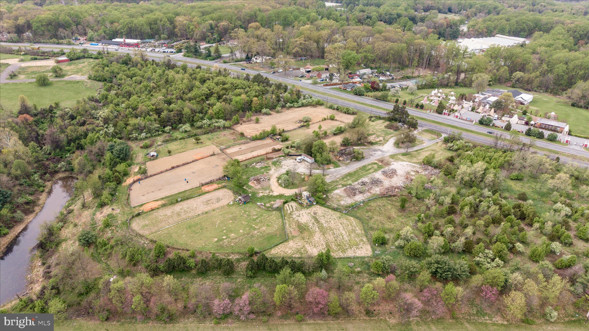 Rare 9.5-acre opportunity in Burtonsville — level, fertile land just minutes from amenities and close to the watershed. Zoned RC with one approved building lot (no further subdivision). Perc testing is underway; final health-department results and approved perc site expected in May.
The parcel is mostly open with scattered trees that could be partially cleared to expand options.  Historically used for garden plots and a farm stand, the soil is ideal for productive small-scale agriculture.

Some Possibilites:
A private homestead or estate with room to roam
Residential Care Facility to 8 people 
Family Day Care Facility to 12 people
Equestrian  Use
Agri-tourism: pick-your-own orchards/berry fields, corn mazes, hayrides
Educational/experiential offerings: farm tours, beekeeping, cheesemaking, goat yoga, kids’ camps
Direct-sales: farmstand, farmers’ market, vineyard tastings
Buyer should confirm all planned uses with Montgomery County zoning. 

Note: impervious coverage limited to 8% of the property.  

Make your dreams a reality with this unique opportunity.