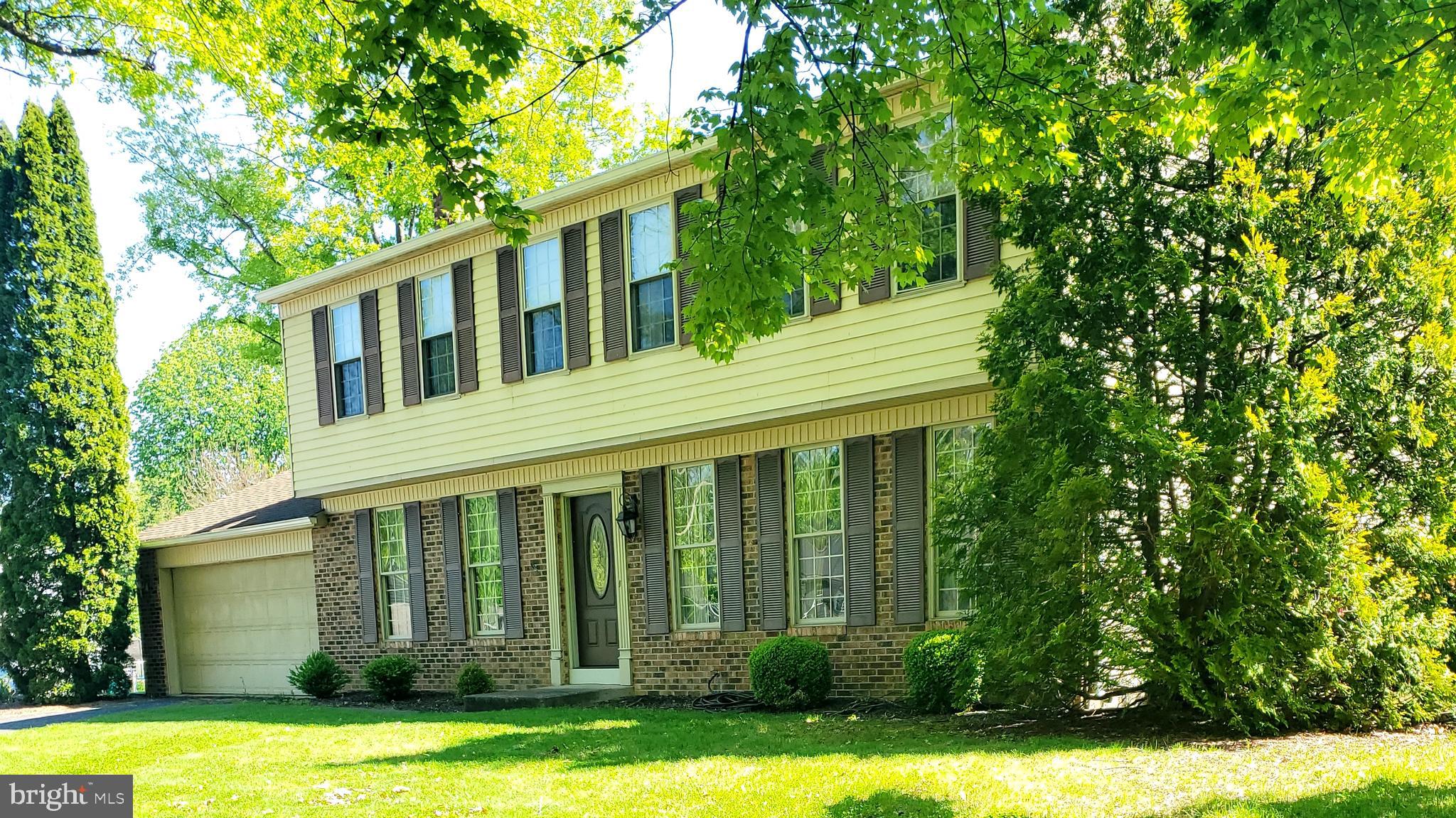 Two story home on large corner lot near shopping , hospital and golf course.  Newer hot water heater., furnace and AC unit.  Full unfinished basement affords lots of storage. Step -down family room with fireplace.  Home priced to sell as is.