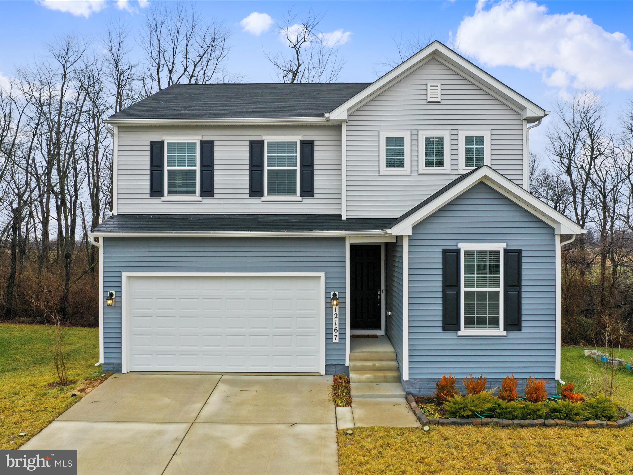 Look no further! This meticulously maintained, barely lived in, like new 4 bedroom/3 full bathroom home in sought after Hagers Crossing neighborhood is now awaiting new happy homeowners. Features include a large main level bedroom, full bathroom with easy walk-in shower, stunning gourmet kitchen, huge living room, and maintenance free Trex-deck overlooking trees and fields. Second floor spacious loft area would make the perfect office or hobby area, large bedrooms with plenty of closet space, primary bedroom with a huge walk in closet and private bathroom featuring all the bells and whistles. Laundry conveniently on bedroom level. Full, 1,113 sq. ft. unfinished basement is a clean slate ready for your finishing touches. It is already plumbed for a full bathroom and has a ground level walk-out to the private patio.  There is plenty of space for a fifth bedroom, full bathroom, and a huge family room/recreation room that would make the perfect in-law suite or guest accommodations. The oversized attached two car garage has an 8-foot garage door, extra high ceiling, and comes already equipped with an EV charging station. There are so many amenities such as walking/jogging trails, pool, tennis and basketball courts, picnic pavilion, and children's playground/tot lot. There is something for all to enjoy! Don't wait months for new construction, this gorgeous 3 year old home is available now, completely move in ready and shows like new. Ideal commuter location within a mile to I-81, minutes to I-70 and the Maryland and PA state lines, and only 35 minutes to Frederick and the MARC train station. Close proximity to shopping, restaurants, and downtown Hagerstown featuring the historic Maryland Theatre and Meritus Ballpark. Don't miss your opportunity. Get ahead of the spring market rush and schedule your showing today!