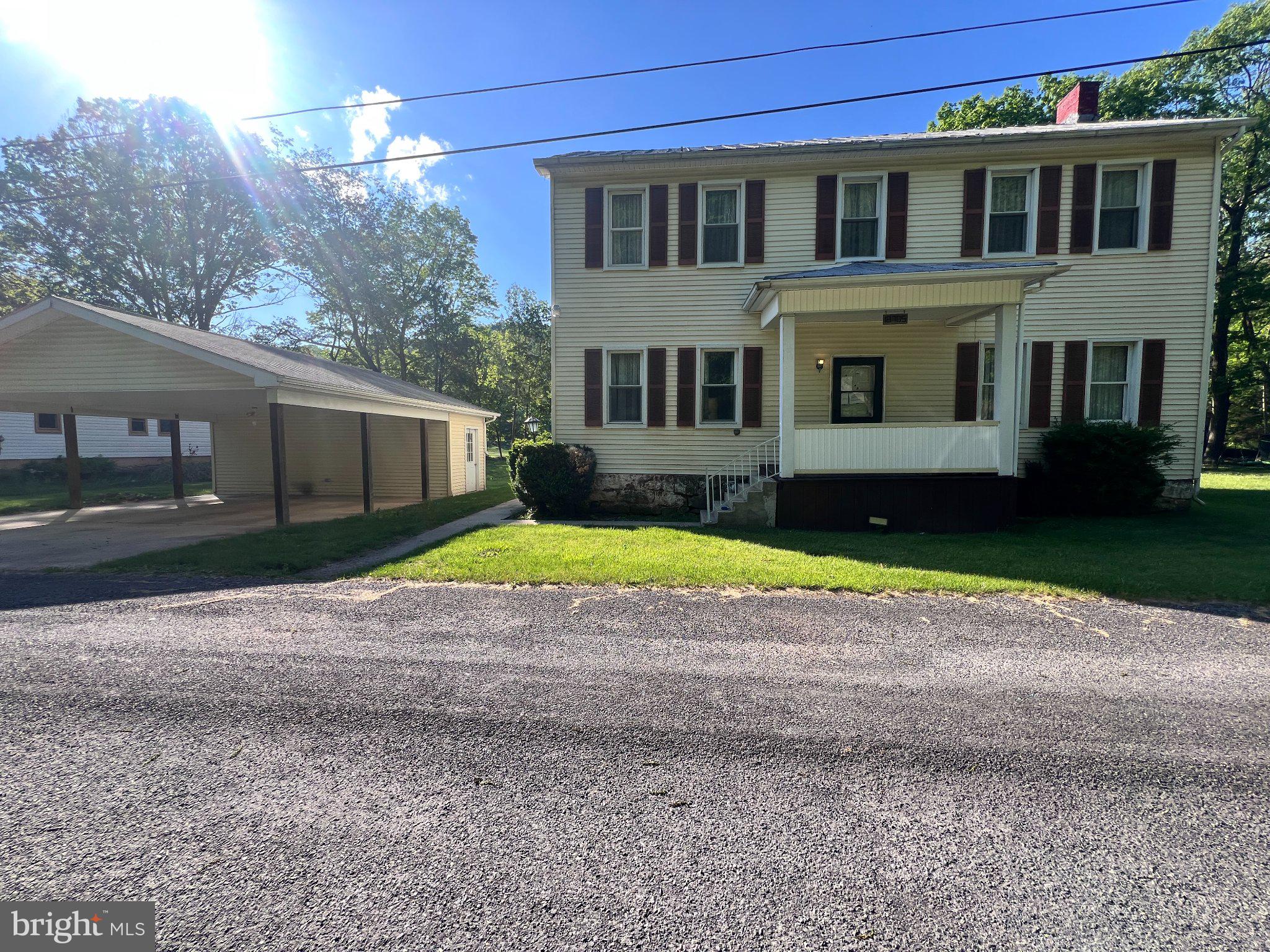 Updated Colonial with newer upgrades and much potential.

Newer bedroom  suite (on main floor) with handicap bath (separate entrance would make handicap access easier).   

Living room and kitchen have built-ins.

Large kitchen with plenty of room and w/d hookup.  

Front and rear covered porched and separate entrance to first floor bedroom.

Second floor has three bedroom and second floor landing is open.  

Two car carport has concrete pad and attached storage.

Updated heat pump provides heating and cooling.

Just short of half acre.
Within flood plain.

Sold as-is
