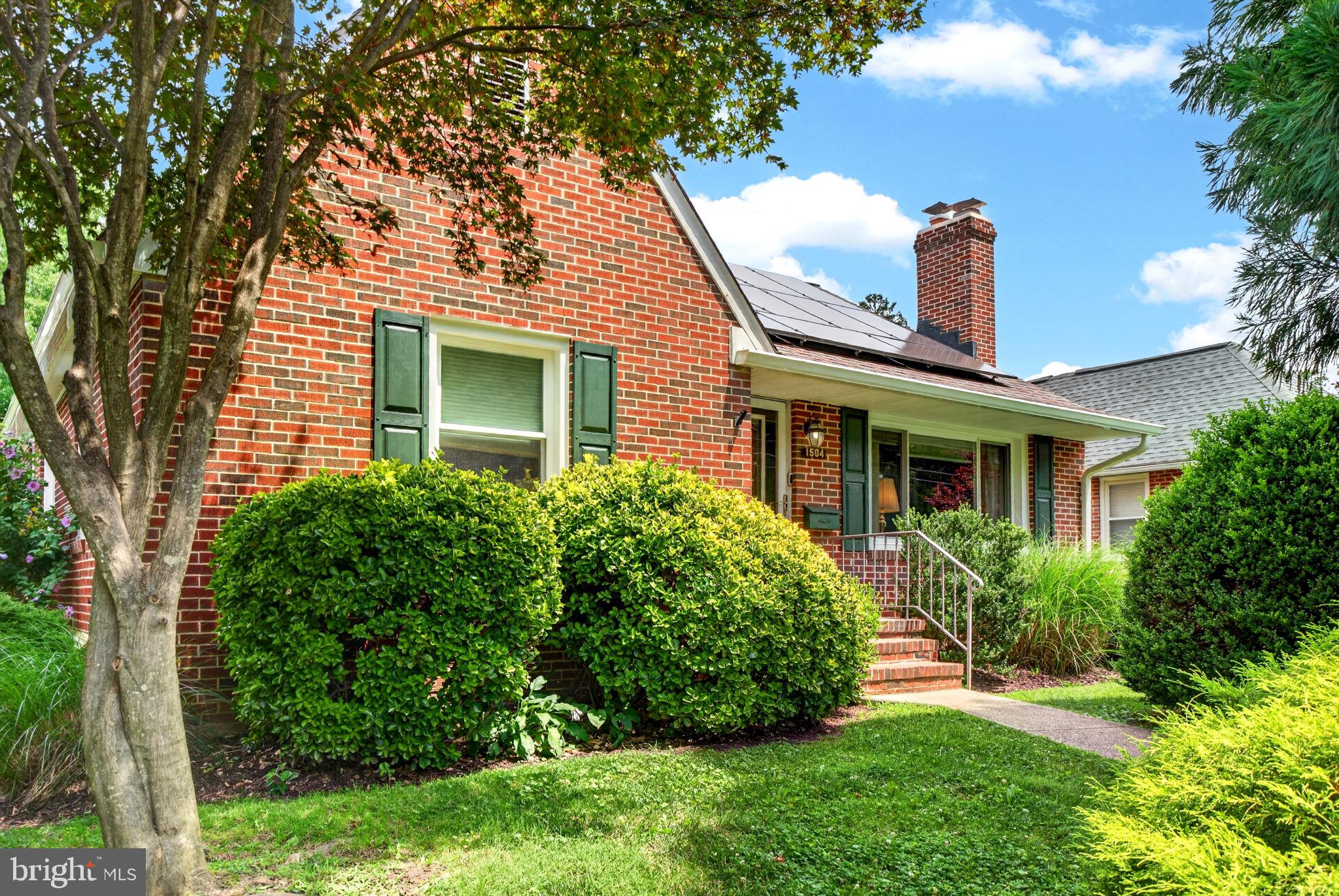 Welcome to Catonsville! - This classic brick home features large rooms with beautiful hardwood floors, a fenced yard with off street parking, a fully finished basement with walk-out, tons of storage, recently installed solar panels for a low monthly electric bill, and a walk-up attic. Everything has been updated in recent years including several new windows with transferrable warranty (including the beautiful large picture window in the front). The main level boasts a large and bright open kitchen/ dining area & living room with cozy gas fireplace. Relax in the enclosed back 3 season room or catch some sun on the back deck. The yard is fully fenced for privacy and security and contains plenty of room to relax and entertain. The lower level features a large bedroom, full bath, family room area along with a huge studio/ workshop room. Come see this one today before it's too late!