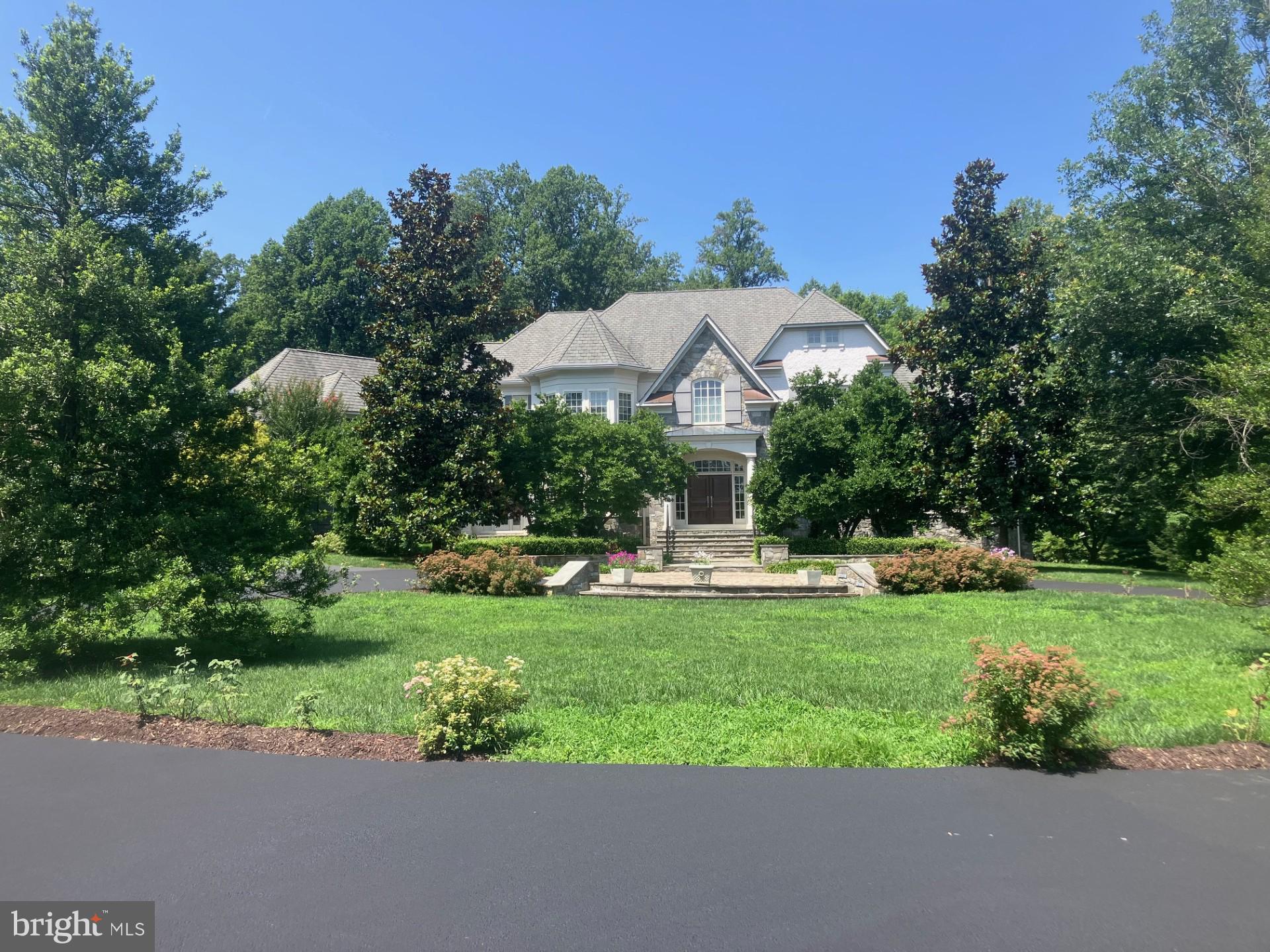 Former MODEL HOME, Original Owner, Gently-Lived-In *Like-New Condition * First-Offering * Nestled within one of Potomac’s most prestigious enclaves, this exceptional residence is a masterclass in refined luxury and thoughtful design, just outside of DC in Potomac, MD * Stone Pillars & Wrought-Iron Entry-Gate extends Stately, Serene passage to pleasing Circular-Drive, surrounding circular Stone-Paver-Patio to covered-entry Wooden Double-doors * GRAND-Hall Welcomes friends & family ! Six to Seven Bedrooms, each with Private Bath, & Walk-In Closets * 6 Full Baths * 3 Half-Baths * Spiral and Multiple Staircases w/attractive Wrought-Iron Spindles yield access to the refined Upper-Level 5-6 Bedrooms & TWO Balconies with calming views of the landscaped grounds * Gourmet Kitchen SUB-ZERO, Continent-size-Island w/Built-In Food-Warmer, Microwave, 2nd-Sink * Gleaming Granites & Stainless-Steel, Six-Burner Gas Cook-Top, NEW Dbl-Wall Ovens,  Ceramic-Back-Splash * Kitchen Overlooks into Bright Sunroom, and also leads into delightful Breakfast-area, opening to super Family-Rm with Gorgeous Stone floor-to-wall GAS Fireplace ( 1 of4 FP's ) Family-Rm TALL Trey Ceiling & Box-Bay Bump-Out viewing rear Court-Yard, landscaped acreage, and SLATE-Patio * SOO NICE ! There's a Wine-Room/Butler's Pantry with Wine-Cooler & Glass Cabinetry off the Gourmet Kitchen too !
Main-level (12-ft ceilings thru-out & taller ) boasts an Arch-entry to the unique Conservatory with an Awe-Inspiring decorative 23-ft-Tall trey-ceiling, floor-to-ceiling windows , plus a warming gas Fireplace
(2nd of 4 ) * Separate formal Dining-Rm opens to Main-Hall & Butler's Pantry * Main-level refined Office views rear Court-yard & provides opulent wooden Built-In Bookcases * Helpful main-level Laundry-Rm features Stone-flooring, Full-Size Sink, counter-tops and Cabinetry * Powder-Rm, Half-Bath * Mud-Room leads to TWO 2-Car-Garages, & has 3rd Staircase to Upper-lvl Optional-Rm ( or 6th Upper Bedrm ) OR Guest-Room, with Kitchenette & WIC *
THREE Staircases to Upper-Level, the Main Hall beautiful Spiral Staircase with Wrought-Iron Spindles bring you to 5 private Bedrooms, each with full bath & Walk-Ins * Spacious central-hall Sitting-Area overlooks landscaped front-yard, Circular Stone-Paver Patio and peaceful views * Primary Bedroom is Spacious and Grand, satisfies the owner with a Balcony facing the rear landscaped lawns that provides tranquility * His & Hers Walk-ins ( *hers is in the "Sex & the City" movie-style "TO-DIE-FOR" mode * ) * Sitting-Room, and the impressive Primary dual-sided bathroom exudes quality & comfort, Over-Sized Jacuzzi tub, walk-In Ceramics Shower with multiple Shower-Heads and Sit-Down area, each partner has their own separate area granite-sinks and dressing area *
Bedrooms 2 through five offer wonderful views of the grounds, their own PRIVATE BATH, and Walk-In Closets * The finished Lower Level brings smiles and joy the lucky new homeowners, Arch-Way & Pillars-entry to Theatre-Room to fit 25, Sound-System hook-ups for the home, inside & out * PRIVATE Gym to keep fit & Healthy * SIXTH Bedroom with private Bath & Walk-In * Family-Room with gleaming Granites, Refrigerator Wet-Bar, Wine-Cooler& FOURTH warming-Gas  STONE-Quality finish Fireplace * HUGE Recreation-Room leading to GYM-Rm & additonal Entertainment Room* TONS of STORAGE Everywhere ! * This exceptional property is conveniently located just 5 minutes to Potomac Village, offering easy access to local shopping, dining, and other amenities. Commuting is also a breeze, with major commuter routes such as River Road, Falls Road, Clara Barton Parkway, and 495 within easy reach. 
This fabulous home enjoys easy access to 1-495 and 1-270 as well as Washington, DC and Northern Virginia. Area residents can take advantage of the fine Montgomery County schools in the Winston Churchill Cluster as well as notable private schools. Recreation possibilities abound with a number of nearby public parks and golf courses.