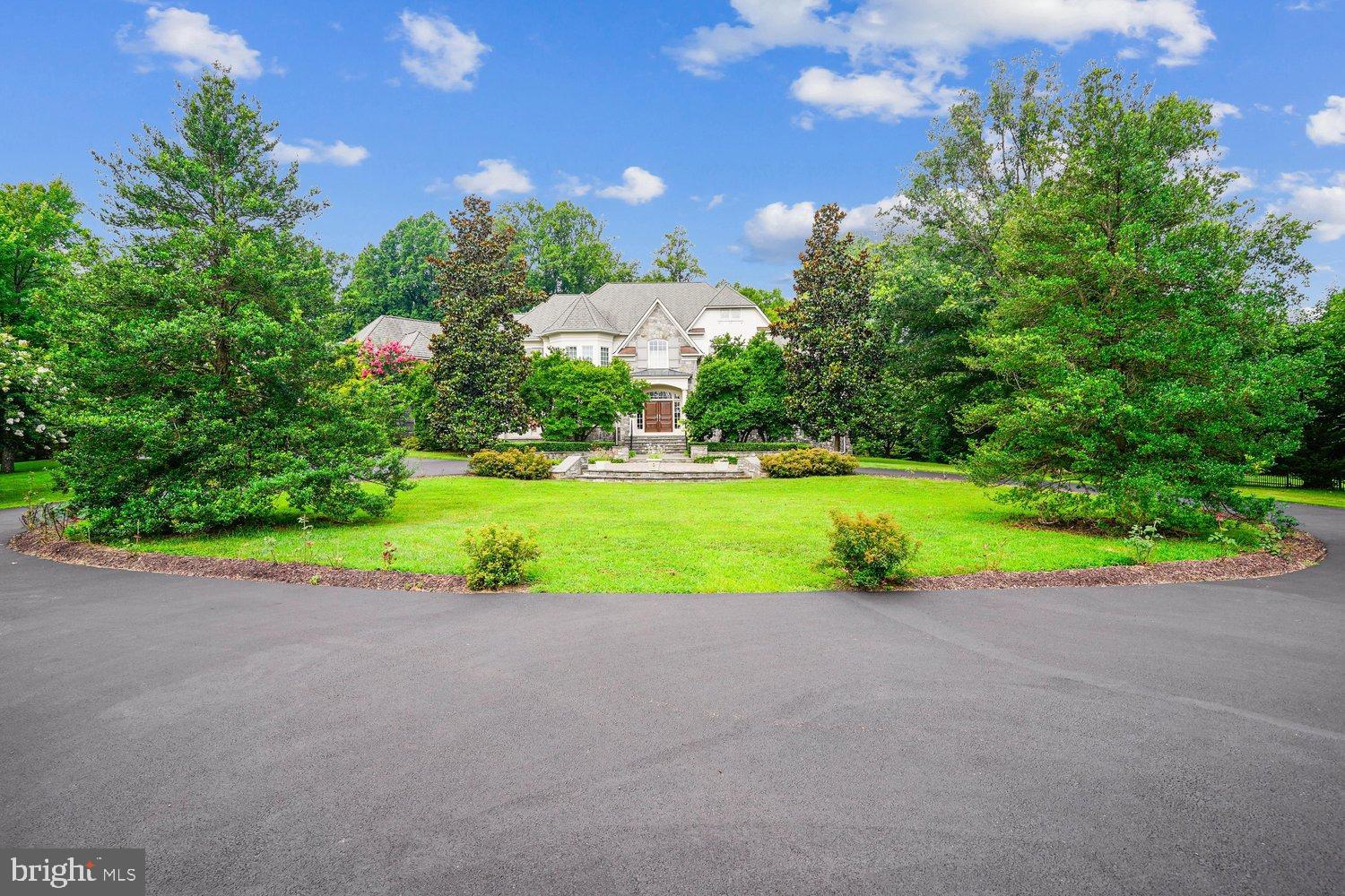 Former MODEL HOME, Original Owner, Gently-Lived-In *Like-New Condition * First-Offering * Nestled within one of Potomac’s most prestigious enclaves, this exceptional residence is a masterclass in refined luxury and thoughtful design, just outside of DC in Potomac, MD * Take the Virtual 3-D walking tour * Stone Pillars & Gated-Steel Privacy fencing extends Stately, Serene passage to pleasing Circular-Drive, surrounding circular Stone-Paver-Patio to covered-entry Wooden Double-doors * GRAND-Hall Welcomes friends & family ! Six to Seven Bedrooms, each with Private Bath, & Walk-In Closets * 6 Full Baths * 3 Half-Baths * Spiral and Multiple Staircases w/attractive Wrought-Iron Spindles yield access to the refined Upper-Level 5-6 Bedrooms & TWO Balconies with calming views of the landscaped grounds * Gourmet Kitchen SUB-ZERO, Continent-size-Island w/Built-In Food-Warmer, Microwave, 2nd-Sink * Gleaming Granites & Stainless-Steel, Six-Burner Gas Cook-Top, NEW Dbl-Wall Ovens,  Ceramic-Back-Splash * Kitchen Overlooks into Bright Sunroom, and also leads into delightful Breakfast-area, opening to super Family-Rm with Gorgeous Stone floor-to-wall GAS Fireplace ( 1 of4 FP's ) Family-Rm TALL Trey Ceiling & Box-Bay Bump-Out viewing rear Court-Yard, landscaped acreage, and SLATE-Patio * SOO NICE ! There's a Wine-Room/Butler's Pantry with Wine-Cooler & Glass Cabinetry off the Gourmet Kitchen too !
Main-level (12-ft ceilings thru-out & taller ) boasts an Arch-entry to the unique Conservatory with an Awe-Inspiring decorative 23-ft-Tall trey-ceiling, floor-to-ceiling windows , plus a warming gas Fireplace
(2nd of 4 ) * Separate formal Dining-Rm opens to Main-Hall & Butler's Pantry * Main-level refined Office views rear Court-yard & provides opulent wooden Built-In Bookcases * Helpful main-level Laundry-Rm features Stone-flooring, Full-Size Sink, counter-tops and Cabinetry * Mud-Room leads to TWO Over-Sized 2-Car-Garages, & has 3rd Staircase to Upper-level 6th Bedroom/In-Law-suite / Au-Pair-Suit with Kitchenette & Walk-In-Closet * 
THREE Staircases to Upper-Level, the Main Hall beautiful Spiral Staircase with Wrought-Iron Spindles bring you to 5 private Bedrooms, each with full bath & Walk-Ins * Spacious central-hall Sitting-Area overlooks landscaped front-yard, Circular Stone-Paver Patio and peaceful views * Primary Bedroom is Spacious and Grand, satisfies the owner with a Balcony facing the rear landscaped lawns that provides tranquility * His & Hers Walk-ins ( *hers is in the "Sex & the City" movie-style "TO-DIE-FOR" mode * ) * Sitting-Room, and the impressive Primary dual-sided bathroom exudes quality & comfort, Over-Sized Jacuzzi tub, walk-In Ceramics Shower with multiple Shower-Heads and Sit-Down area, each partner has their own separate area granite-sinks and dressing area *
Bedrooms 2 through five offer wonderful views of the grounds, their own PRIVATE BATH, and Walk-In Closets * The finished Lower Level brings smiles and joy the lucky new homeowners, Arch-Way & Pillars-entry to Theatre-Room to fit 25, Sound-System hook-ups for the home, inside & out * PRIVATE Gym to keep fit & Healthy * SIXTH Bedroom with private Bath & Walk-In * Family-Room with gleaming Granites, Refrigerator Wet-Bar, Wine-Cooler& FOURTH warming-Gas  STONE-Quality finish Fireplace * HUGE Recreation-Room leading to GYM-Rm & additional Entertainment Room* TONS of STORAGE Everywhere ! * This exceptional property is conveniently located just 5 minutes to Potomac Village, offering easy access to local shopping, dining, and other amenities. Commuting is also a breeze, with major commuter routes such as River Road, Falls Road, Clara Barton Parkway, and 495 within easy reach. 
This fabulous home enjoys easy access to 1-495 and 1-270 as well as Washington, DC and Northern Virginia. * Fine Montgomery County schools in the Winston Churchill Cluster as well as notable private schools. Recreation possibilities abound with a number of nearby public parks and golf courses.