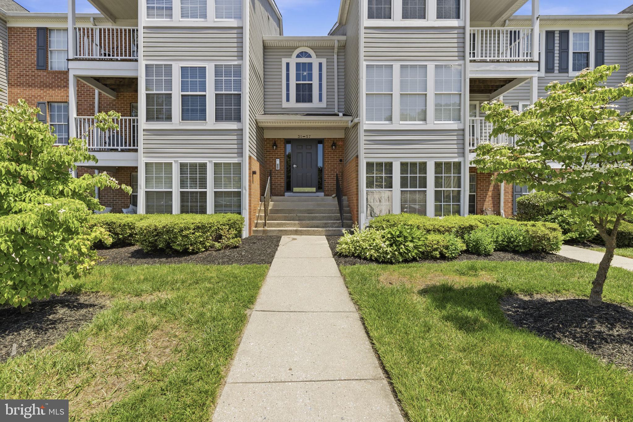 Move-in-ready and beautifully maintained penthouse condo with 2 bedrooms and 2 full baths. The open-concept floor plan features luxury vinyl plank flooring, vaulted ceilings, and abundant natural light throughout. The updated kitchen boasts granite countertops, a tile backsplash, pantry, double sink, stainless steel appliances, breakfast bar seating, and modern white cabinetry with hardware. The bright dining area includes a sunroom feel with expansive windows and French doors leading to a private balcony. Spacious primary suite features a walk-in closet and updated en-suite bath with walk-in shower. The second bedroom offers generous space and a ceiling fan. Additional highlights include secure building access, in-unit laundry room with storage shelving, updated hall bath, and public water and sewer. Major updates include HVAC (2017), LVP flooring, and windows approximately 5 years young. The condo fee includes water and trash service, adding to the convenience of low-maintenance living. A fantastic opportunity to enjoy your new home just minutes away from shopping, dining, parks, and major commuter routes for added convenience.