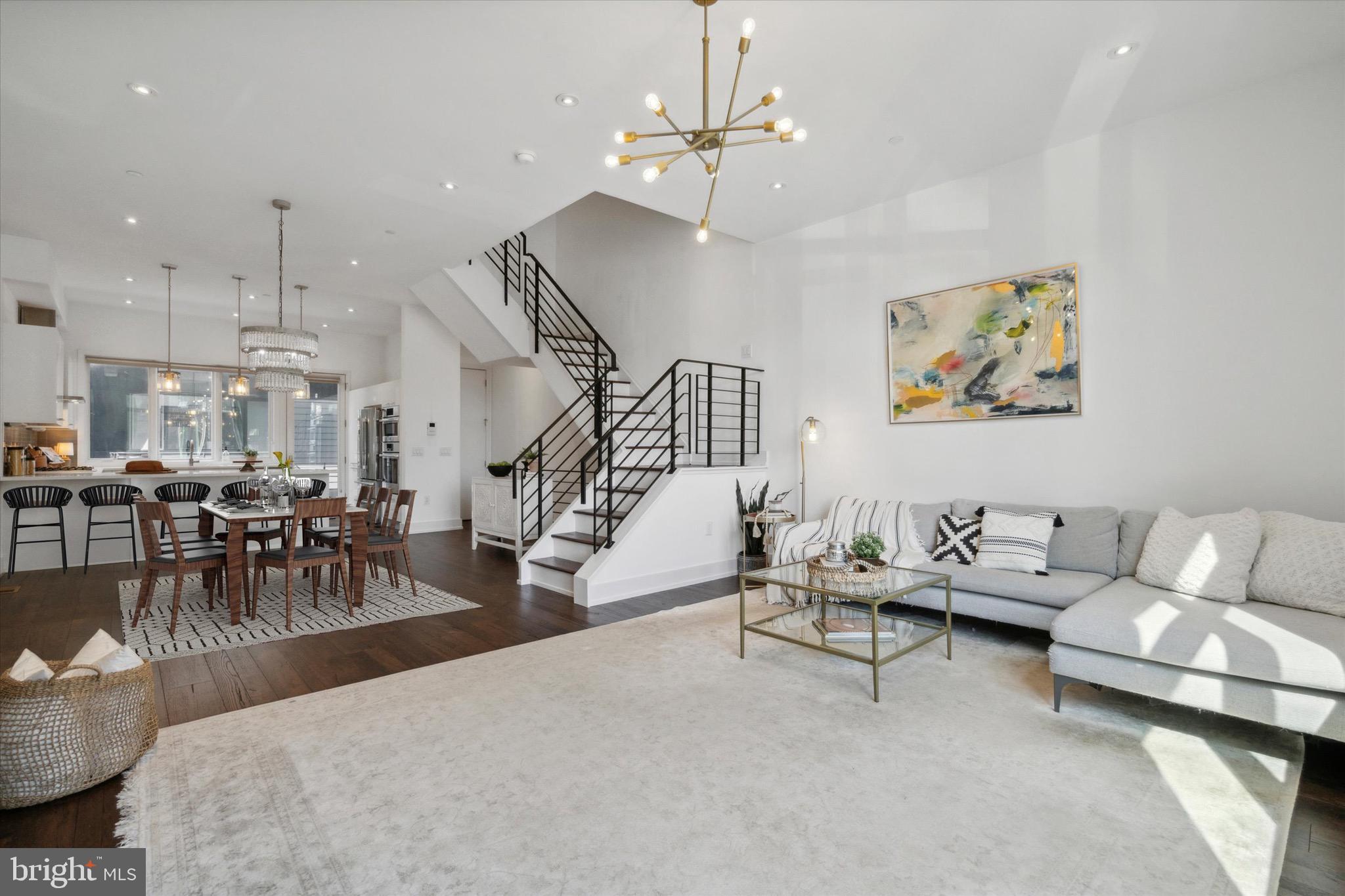 Stunning luxury townhome in the heart of Northern Liberties.  618 N. 5th Street is in Liberty Square which is a gated enclave of private homes. This home features 4 bedrooms, 4 ½ baths, a two car garage, and a rooftop deck offering breathtaking views of the Philadelphia skyline.   Upon entering the home, you will feel the modern vibe with dark hardwood floors and black wrought iron railings leading to the upper and lower levels.  Upon entering the home on the lower level, you will find the first of 4 bedrooms; this room can be used for guests or as a home office.  As you head to the main level of the home you are greeted with an abundance of light and an open floor plan.  This is ideal when entertaining family and friends.  The kitchen features premium appliances, plenty of prep space, and access to a Juliet balcony where you can enjoy your morning coffee.
 
As you move toward the hallway, you will find a beautifully appointed wrought iron staircase leading to the second floor.  Here you will find an open loft that is perfect for a cozy seating area or home office. Adjacent to the loft you will find the second and third bedrooms which both have their own private en-suites as well as second-floor laundry. 
 
The entire 3rd level of the home is the master suite and provides a welcome retreat after a long day.   There is a custom closet system, spacious bed room,and more large windows for plenty of light.  The ensuite is beautifully designed with a large walk-in shower and glass door, sunk in tub, two separate sinks and private water closet.
 
The upper level ( rooftop deck ) of the home is a showstopper with impressive views of the Philadelphia Skyline!
 
ADDED BONUS:
Full finished basement complete with beverage center and full bath!