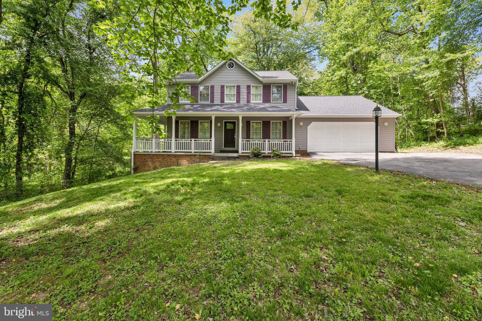 Welcome to this beautifully maintained two-story Colonial nestled on a serene 1.18-acre lot in Pomfret, Maryland. Close to schools, shopping, restaurants and commuter routes.  With 2,356 square feet of finished living space, plus a huge unfinished basement with a rough-in for a future bathroom (offering endless future expansion). This home offers the perfect blend of comfort and style! Stunning kitchen with granite counter tops, stainless appliances and a custom tiled backsplash. Gleaming wood and ceramic tile floors.  Featuring 4 spacious bedrooms and 2.5 bathrooms, the layout includes a dedicated office, formal living and dining rooms, and a bright kitchen that opens to the inviting family room with a cozy woodburning insert within the brick fireplace. Enjoy outdoor living on the inviting front porch OR on the expansive deck OR under the stunning newly added gazebo (2022) in the park-like setting of the beautiful private backyard oasis. Major updates include a brand-new front door April 2025, new siding, roof, and shutters (May 2024), a new HVAC system (July 2020), and a new washer and dryer (2022). This move-in ready gem combines peaceful surroundings with practical upgrades—The perfect place to call home! Schedule your private showing today before it is gone!