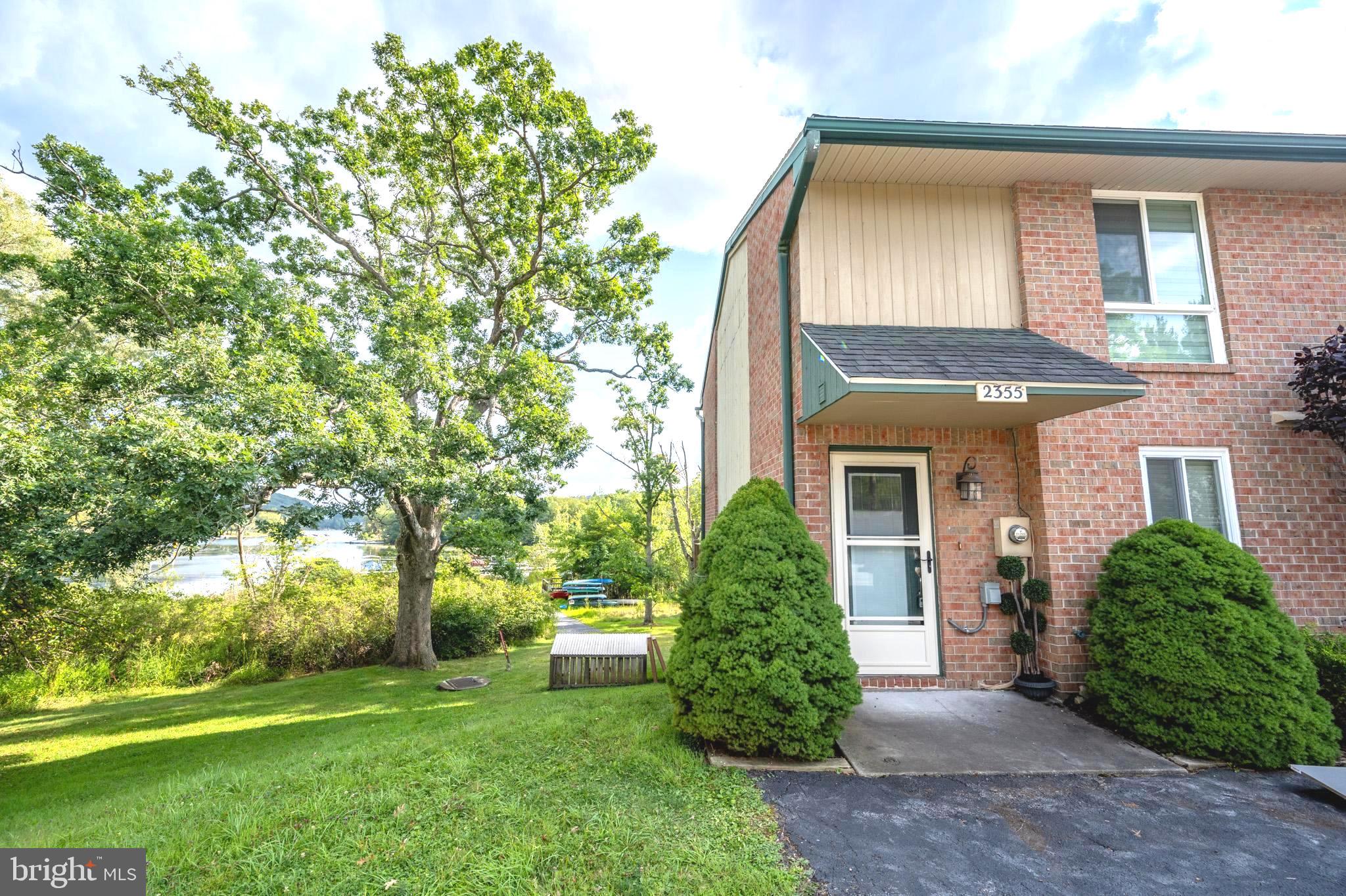 Steps away from the waters of Deep Creek Lake- this turn key end unit with 2 beds, 2 1/2 baths and 3 levels of living space is just waiting for you. Recently remodeled, with a bright and airy feel throughout. Perfect location  for boat days on the lake and snow days at Wisp, and walking distance to multiple restaurants and stores. Dock slips available through the condo association. Tesla charger with unit. Featuring amenities such as-  recreational/community building, tennis court, play/picnic area. Dock slips available through the condo association. rentals prohibited.