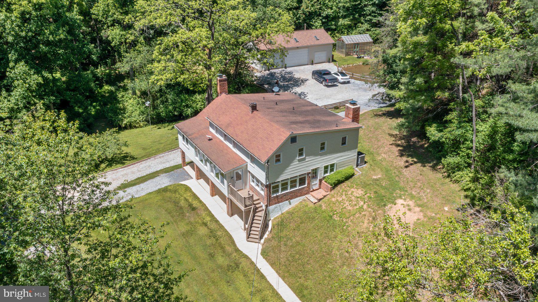 Private Country Estate on 23+ Acres
Discover the perfect blend of comfort, space, and country charm with this beautifully maintained 4-bedroom, 2-bath home nestled on over 23 acres of picturesque land. Featuring gleaming hardwood floors, three fireplaces, and inviting porches, this property offers warmth and unique character throughout.
Designed for both everyday living and outdoor enjoyment, the estate includes a detached 4-car garage with workshop space, plus an attached 1-car garage for added convenience. Nature lovers and equestrian enthusiasts will appreciate the scenic pond, greenhouse, and horse paddock, creating endless opportunities for recreation and hobby farming. Nature abounds throughout the property!
Adding to its exceptional value, the property has already passed a perc test for an additional home, with plans available—ideal for a guest house, family compound, or future investment.
A rare opportunity to own a versatile, well-appointed property offering privacy, acreage, and room to grow.** Schedule your tour today and experience all this remarkable property has to offer.**