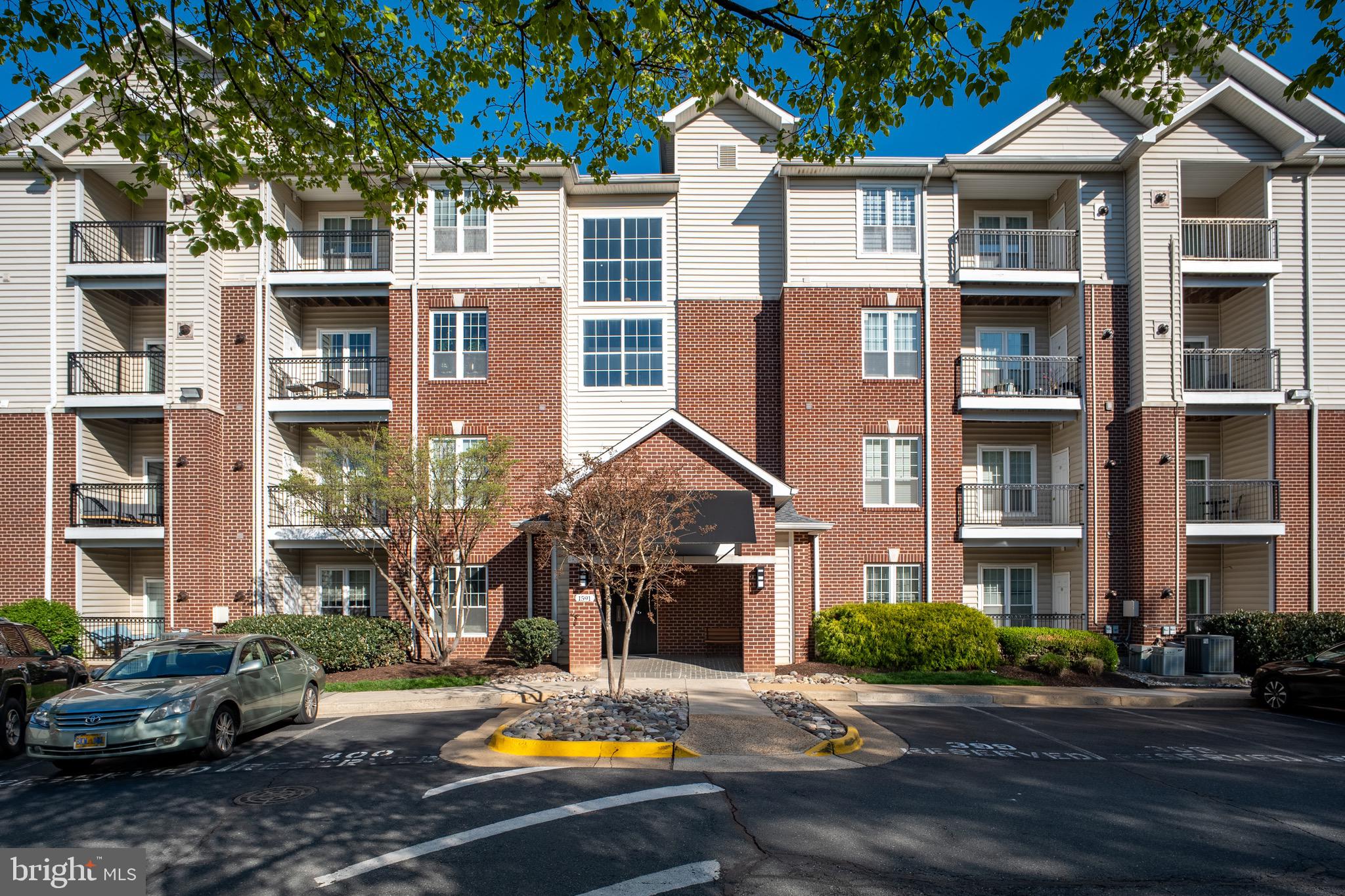 Call listing agent during open house if you can not enter. Experience the perfect combination of space and convenience in this rarely available ground-floor residence at the gated Gates of McLean! Featuring a highly desirable "roommate-style" layout, this 2-bedroom, 2-bathroom unit spans over 1,200 sq. ft.—making it one of the largest floor plans available in the community.

The Highlights:

Exceptional Outdoor Space: This unit boasts an oversized private balcony that offers a peaceful, scenic view of the lush, tree-filled courtyard. It’s a rare find that provides a seamless indoor-outdoor flow—perfect for pet owners or those who enjoy a quiet garden-like retreat.

Spacious & Open Living: The expansive living and dining area is designed for flexibility, featuring clean lines, elegant crown molding, and recessed lighting throughout.

Modern Kitchen: A gourmet galley-style kitchen featuring sleek granite countertops and stainless steel appliances.

Unbeatable Tysons Location: A true commuter’s dream! Just a short walk to the McLean Metro Station (Silver Line) and seconds from I-495, I-66, and the Dulles Toll Road. Walk across the street to Wegmans and Capital One Center or enjoy world-class shopping at Tysons Corner Center and Galleria.

Resort-Style Amenities: Enjoy secure, gated living with a clubhouse, fitness center, sauna, outdoor pool, basketball courts, and a private movie theater.

Includes assigned parking. Move-in ready and perfectly positioned for those seeking maximum square footage with the ease of 1st-floor, no-stairs accessibility!

Parking: Assigned parking space #400 located directly in front of the building entrance.