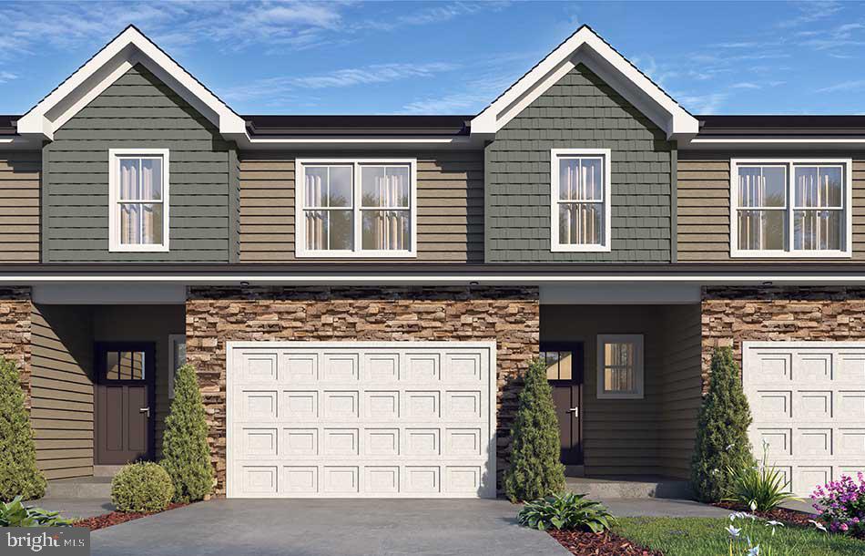 NEW BUILDING UNDER CONSTRUCTION!  LOT 8 is an END UNIT in the newest building at Hawkstone Village.  Stylish, low-maintenance living meets modern charm in this beautifully designed townhome in Hawkstone Village. Striking stone exterior, shake accents, and welcoming front entry welcome you before you even step inside. The open-concept main living area was designed for both everyday living and entertaining, featuring a spacious great room with vaulted ceilings and a beautiful kitchen complete with gray-stained maple cabinetry, quartz countertops, and tile backsplash. Sliding doors lead to a composite deck with view of the open field behind you.  Upstairs, the primary suite offers a walk-in closet and private bath featuring a double-bowl vanity. Two additional bedrooms, a full bath, and generous storage space provide flexibility for family, guests, or a home office. Each home is professionally designed with thoughtfully selected finishes and color palettes to create a clean, modern feel throughout. Enjoy the convenience of low-maintenance living with HOA-covered lawn care, trash removal and snow removal, plus the added benefit of an oversized one-car garage and a great Fleetwood location. Backed by a one-year builder warranty for added peace of mind.