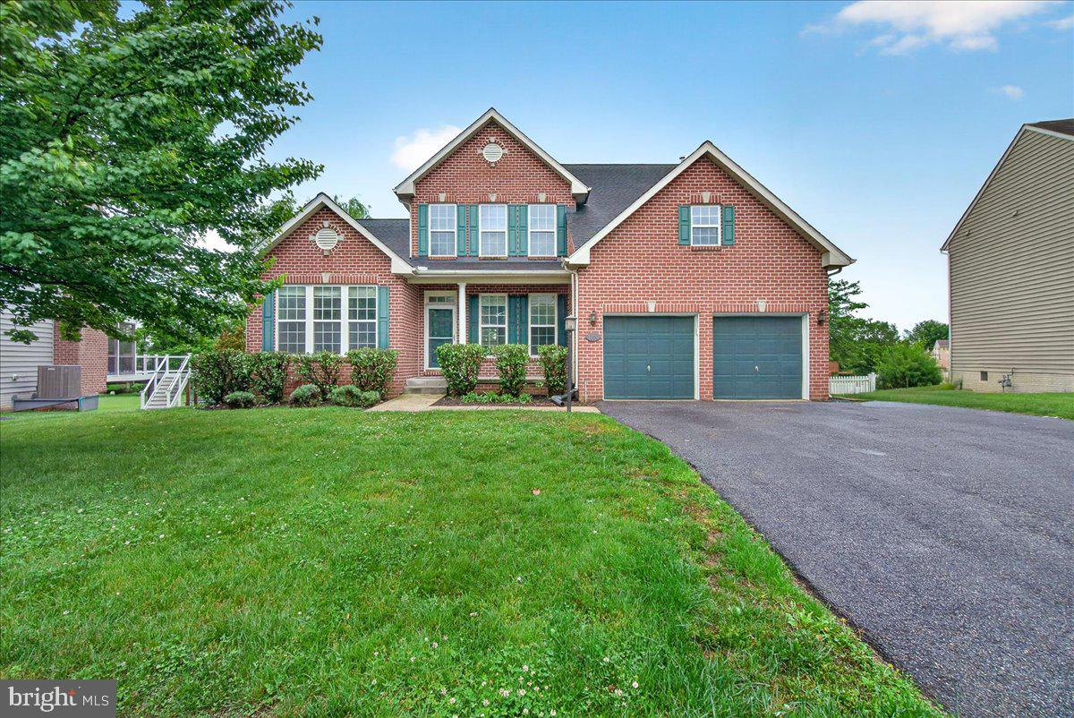 Gorgeous Colonial featuring a rare first-floor in-law suite — perfect for multigenerational living or extended guests. The main level blends formal and casual living with a separate dining room and an open layout centered on a large family room with hardwood floors and a gas fireplace. The kitchen boasts stainless steel appliances, a large center island and flows into a bright morning/sun room.  A large deck overlooking the fenced backyard and — an ideal entertaining space. Upstairs, the primary suite is a true retreat with two walk-in closets and an en-suite bath with a walk-in shower and soaking tub. Three additional bedrooms and a full bath complete the upper level. The finished basement also has a bedroom, full bathroom and a walk-in closet in addition to a large recreation area and walkout to the backyard.
