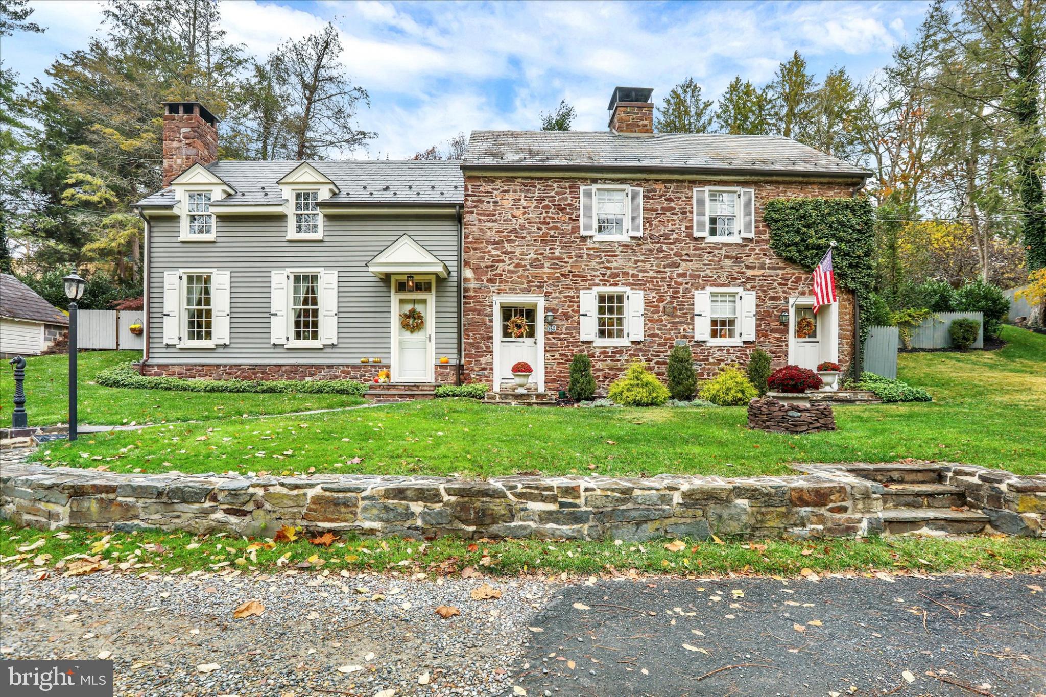 A Timeless Bucks County Stone Home Beauty with Modern addition and renovations. This quiet, and off the beaten path, dead end street - is also just steps from the main street culture and dining in Historic New Hope Boro. The Circa 1797 Stone Home is in the Registry on Historic Places. As you enter the front door of the 2002 addition you will be taken back by the open floor plan with elevated Dining Room and Cathedral Ceilings filled with natural light and accented by the original  exposed stone wall of the historic home.  Through an Archway you enter the remodeled Kitchen with center island, stainless steel appliances, quartzite counter tops and custom tile backsplash. The eat-in area has a beautiful and original decorative wood burning fireplace. Down a small hall is a Main Level Bedroom with adjoining remodeled full bath. Custom built-ins and another original fireplace for charming decor.  This room can also be used as a cozy Den. On the second level find two more bedrooms with decorative fireplaces with new surround tile work. A third room attached to the third bedroom could be used a home office on this level. OR use the finished third floor as the home office or man-cave. A remodeled full bath completes the second level. This home is unique in many ways and one being that there is ground level exits out the second level from the two bedrooms. One to a NEW glorious screened room addition where you will spend most of your relaxing moments in enjoying the peaceful and private views of the gardens and yard. This custom addition with its stone accent wall and vaulted beamed wood ceiling and stone floor is amazing!. There is also incredible hard-scaping that was added by current owners along with an entertaining blue stone patio area, stone staircase to different terraces and gardens. Down a covered walk way, on the other side of screened room, you can also enter into the elevated Dining Room that you saw as you entered the Great Room. Three sets of French doors open into this space and if you picture the whole package you can see the flow of this great home makes for a fantastic entertaining residence. Other bonus features include one car detached garage plus 4 parking spots, new HVAC system for heating and cooling, gas cooking, new gutters, whole house generator and maintained with the utmost care.