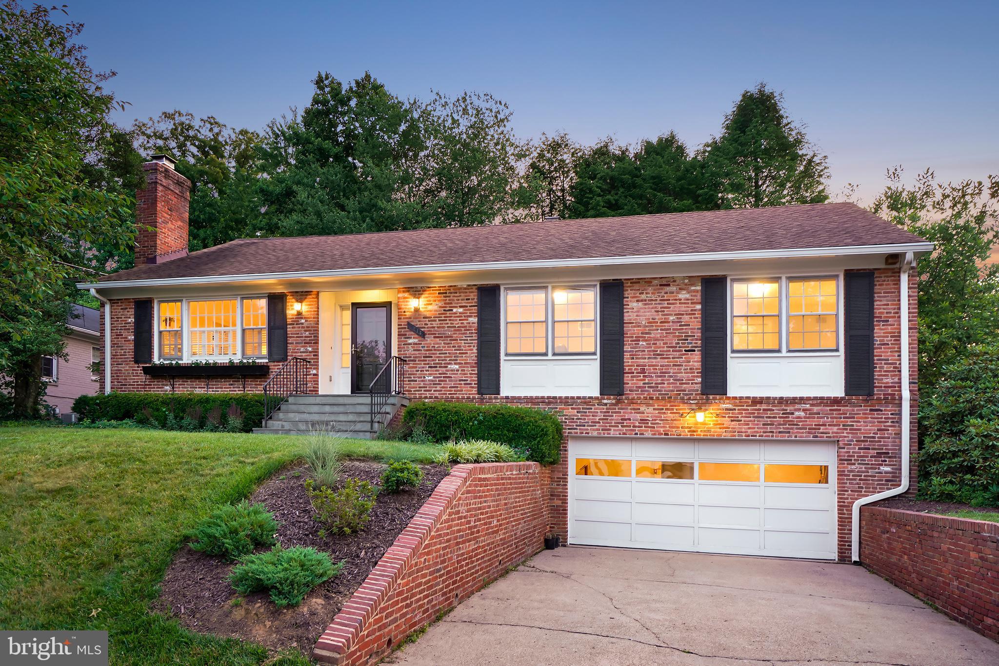 Expansive brick Mid-Century home in the highly sought-after Rollingwood neighborhood of Chevy Chase! The understated exterior opens to reveal a sprawling, sun-filled interior that is sure to impress. Exceptional details are found throughout, including gleaming wood floors, three fireplaces, custom built-ins, Plantation shutters, skylights, and recessed lighting. This distinctive residence offers an outstanding floor plan ideal for entertaining.

The main level features an elegant living room with crown molding and a fireplace, an open formal dining area with crown molding and a corner China cabinet, and a delightful sunroom with a gabled ceiling, a large picture window with bench seating, and access to the stone patio. At the center of the home is the open-concept kitchen, breakfast area, and family room, creating a seamless and comfortable everyday living space. The updated kitchen offers granite counters, a stainless-steel appliance suite, tasteful cabinetry with soft-close drawers, and a charming built-in banquet. Beyond the breakfast area is a sizeable family room with a fireplace flanked by display shelving. The main level bedroom wing includes three well-proportioned bedrooms and two full bathrooms, including a spacious primary suite with a walk-in closet, an additional wall closet, a ceiling fan, and an updated private bathroom with a marble vanity.

The upper level is filled with natural light and includes a sizeable bonus room with three built-in workstations, skylights, a picture window with bench seating, and wall-to-wall carpeting. There is also a large fourth bedroom with a walk-in closet, cedar storage closet, skylights, and built-in drawers and shelving. A full bathroom with an oversized marble vanity completes this level.

The finished lower level has a huge recreation and game room with a fireplace and recessed lighting, a private fifth bedroom, a full bathroom, a laundry room, a storage room, a mudroom area, and access to the two-car garage with a workbench space.

The property is situated on a landscaped lot with mature trees and a picturesque backyard featuring an enchanting stone patio, extensive hardscaping, a deck with a hot tub, and two fenced garden areas ideal for vegetables.

Ideally located in close-in Chevy Chase, this home is convenient to Rock Creek Park, the Capital Beltway, and downtown Washington, D.C., and just minutes from the restaurants, shopping, and entertainment of downtown Bethesda and Silver Spring. Located in the sought-after Bethesda-Chevy Chase High School cluster.
