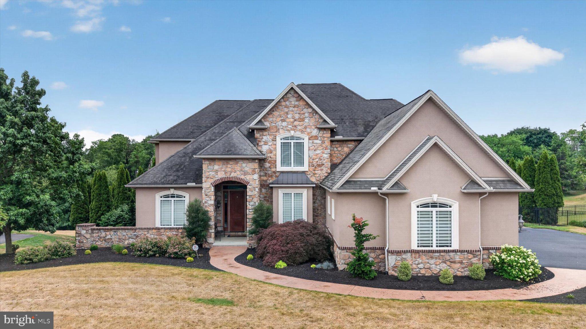 Discover true luxury living in this stunning custom-built home by Ionni Builders in the highly desirable Deaven Woods community of Harrisburg. Offering 5 bedrooms, 3 full baths, and 2 half baths, this residence showcases premium craftsmanship and high-end finishes at every turn.

Step inside to an impressive main level featuring a custom-designed gourmet kitchen with granite countertops, luxury appliances, a spacious center island, and abundant cabinetry — perfect for both everyday living and entertaining. The elegant primary suite includes a spa-like bath with a custom walk-in shower, rainfall shower head from the ceiling, and carefully selected finishes that elevate the space.

A rare feature of this home is the custom residential elevator that transports you seamlessly from the main level to the fully finished lower level. Downstairs you’ll find a second kitchen/bar area, game room, additional family room, 5th bedroom area, and another custom walk-in shower, creating an ideal space for guests, multigenerational living, or game-day gatherings.

The outdoor living space is an absolute showstopper. The rear yard centers around a heated saltwater inground pool with a custom waterfall feature, surrounded by an expansive paver patio. Enjoy a large gazebo-style covered area with a custom stone fireplace, a full outdoor bar with sink, refrigerator, storage, and a large outdoor TV that remains with the home — a true entertainer’s paradise.

Completing this exceptional property is a fully paid-for solar system that significantly reduces electric costs, adding long-term value and efficiency. All of this is set within the prestigious Deaven Woods development, offering a premier Harrisburg location close to shopping, dining, and major routes.

This is a rare opportunity to own a luxury, amenity-packed home that perfectly blends style, comfort, and thoughtful design — schedule your private tour today.