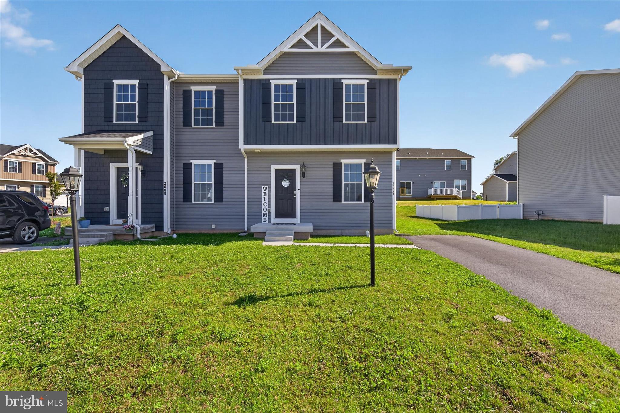 Nearly new in King's Court at Brownstone Manor Subdivision, built by JA Myers in Dover Schools.  This 2-story, 3 bedroom, 2.5 bath semi-detached home features an open concept floor plan with granite counters, an island and stainless appliances in the kitchen which flows into the living room seamlessly.  Vinyl plank on main floor and bathrooms.  A well appointed primary suite with private bath and walk in closet.  There is also room to grow with the unfinished basement with rough in for a bath, and an egress window, awaiting your finishing touch.  Move in without the wait!
