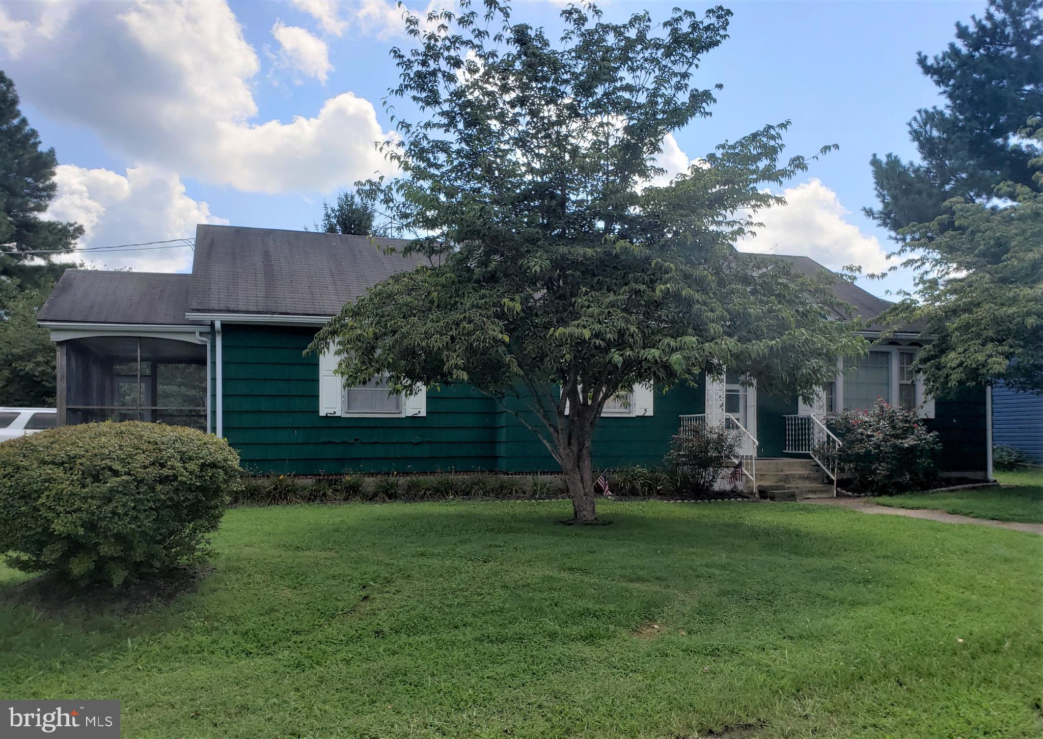 Nice, large in-town lot (includes additional lot, totally .37 acres), spacious rancher with 3 bedrooms, 1 bath.  eat-in kitchen, separate dining area, living room, enclosed porch, 1 car side entry garage, paved driveway...A diamond in the rough just begging to be polished.