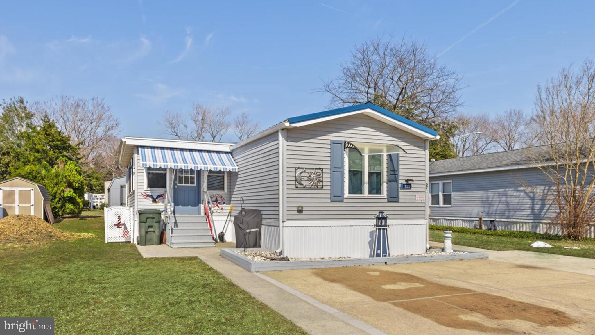 New price! $120,000 — a smart opportunity to own this beautifully updated 1986 home with sunroom, screened porch, and newer shed. What a charmer! Step into this extensively updated home in Angola Beach & Estates through a bright and cheerful sunroom, where newer windows fill the space with natural light. The home opens to a central living area with cathedral ceilings and a ceiling fan, creating a spacious and inviting atmosphere. At the heart of the home, the eat-in kitchen offers coastal painted cabinetry, a pantry, tile backsplash, and a door leading to a relaxing screened porch woth a storage area—an easy place to enjoy the outdoors throughout the seasons.

The split floor plan offers privacy and comfort. The owner’s suite is located at the rear of the home and features board and batten trim work, a walk-in closet, and an ensuite bathroom with a walk-in shower and linen storage. A second bedroom and full bath at the front of the home also include a board and batten accent wall and provide versatile space for guests, family, or a home office, with 2 closets for plenty of storage.

Since purchasing the home,  the sellers have made numerous updates that contribute to the home’s long-term comfort and reliability. Improvements include a durable standing seam metal roof, efficient furnace and air conditioning system, energy efficient double-pane windows throughout the home, updated doors, repiping of the plumbing system, installation of an interior water shutoff valve, installation of a water softener (with replaceable filters) and replacement of the water heater. Additional improvements include newer gutters and downspouts, updated skirting, new vapor barrier and insulation, and a remote-controlled awning at the front entrance. The home also includes a newer 10' x 14' Dutch-style shed, offering convenient storage for tools, beach gear, or seasonal items.

Residents of Angola Beach & Estates enjoy a blend of conveniences designed for easy coastal living. The reasonable monthly lot rent includes water, sewer, and trash service. Optional amenities—available for an additional fee—include two swimming pools, floating dock marina slips, and a storage yard. The community also offers a beautifully renovated community center with resident-planned activities, along with tennis and basketball courts, playgrounds, and generous common areas with pet relief stations.

Residency application required: buyers must pass background and credit checks, along with income and asset verification. This home is not being sold furnished; however, select items may be available for purchase.