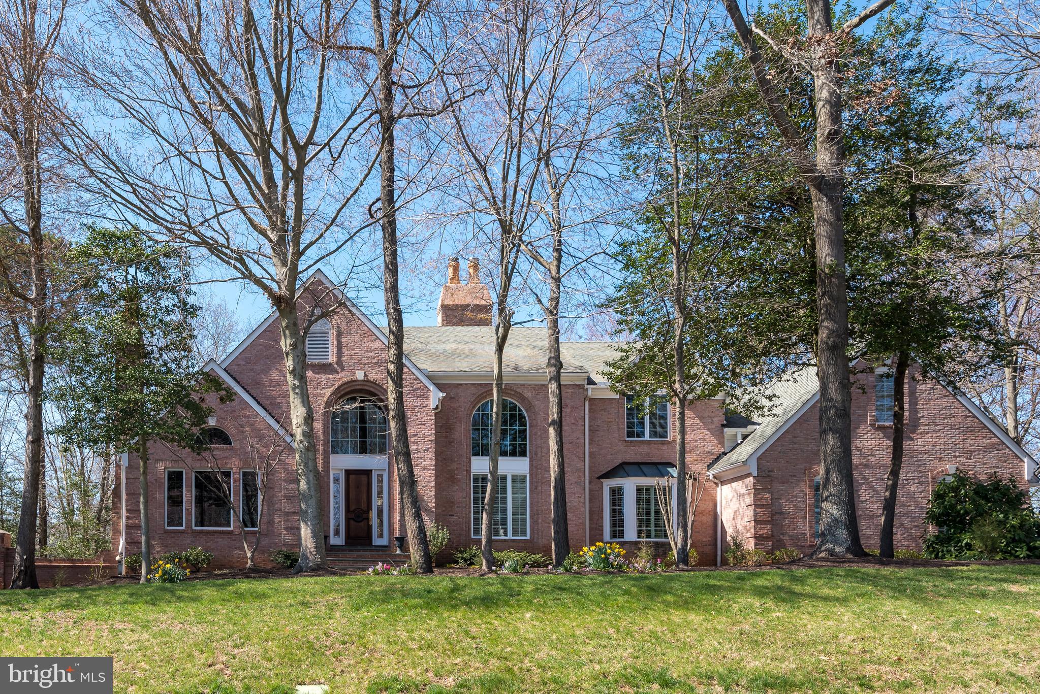 Custom 4-sided brick, luxury estate in desirable Hannah Hills is fabulous inside and out!  Expertly crafted with exquisite attention to detail by Scott Cronacher Estates this elegant home is a masterpiece.  From the stately curb appeal to the dramatic soaring ceilings, you will be awed with the timeless design and thoughtful details that make this lovely property a work of art.  Featuring custom trim, intricate millwork, hand carved fireplace mantels, walls of windows, and a smartly designed floorplan that provides every bedroom with an en suite bath, this classic home is sure to please.  Impressive quality finishes include extensive use of marble and granite, hardwood flooring, high end appliances and quality fixtures.    The massive deck and lower level patio make for perfect outdoor entertaining space.  Beautifully sited on a premium, quiet cul-de-sac lot, the treed lot is almost an acre,  and can accommodate a pool.  This home is perfectly suited for multi-generational living with a main floor primary suite, 2 upper level suites, plus two upper level bedrooms that share a buddy bath, and a lower level full egress au pair or in-law suite.  This gracious home has everything you want on your wish list - main level library,  lower level walk out with home gym, huge rec room with wet bar, extensive storage space, a gardening room and a 3 car garage, all in a fantastic, tree lined neighborhood with excellent schools - Oakton Elementary, Thoreaus Middle, Madison HS.  You will be enchanted by the beautiful details and impressed with the quality of this truly spectacular home!  Put this gracious home on your MUST SEE list!  *Offers will be reviewed Monday at noon.