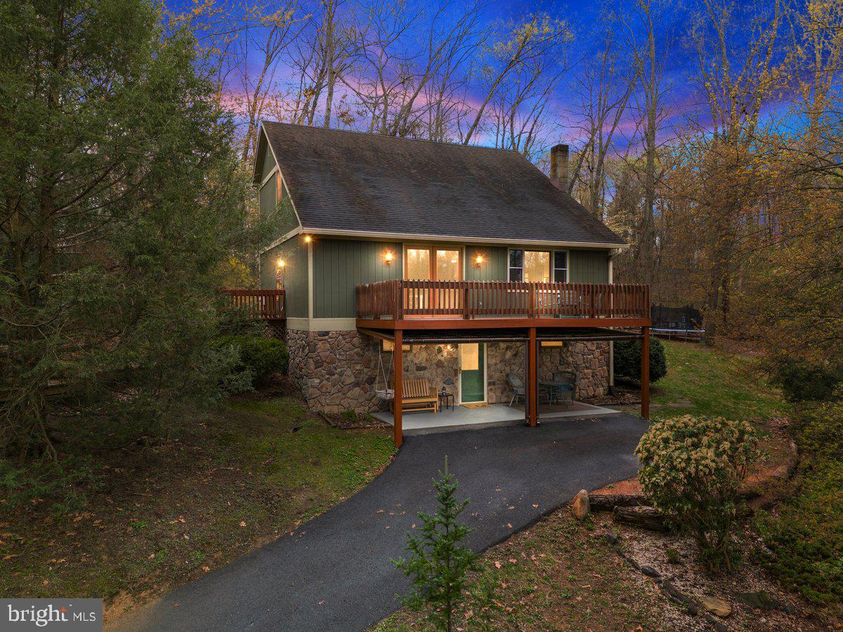 **All Offers due by Saturday, April 19th at 7pm.**
Tucked away in the woods, this 3-bedroom, 2-bathroom cabin is a nature lover’s dream! Featuring a warm, rustic design with stone and wood accents, this home blends seamlessly with its surroundings. Enjoy the serene outdoor spaces, including a spacious deck perfect for relaxing or entertaining. Located just minutes from the C&O Canal towpath and the Potomac River, this home offers easy access to outdoor adventures like hiking, biking, and kayaking. Despite its private setting, you're still close to I-81 for commuting and just a short drive to the MD/WV line for shopping, dining, and more. Whether you're looking for a weekend retreat or a full-time residence, this charming property is a true getaway! Schedule your showing today!