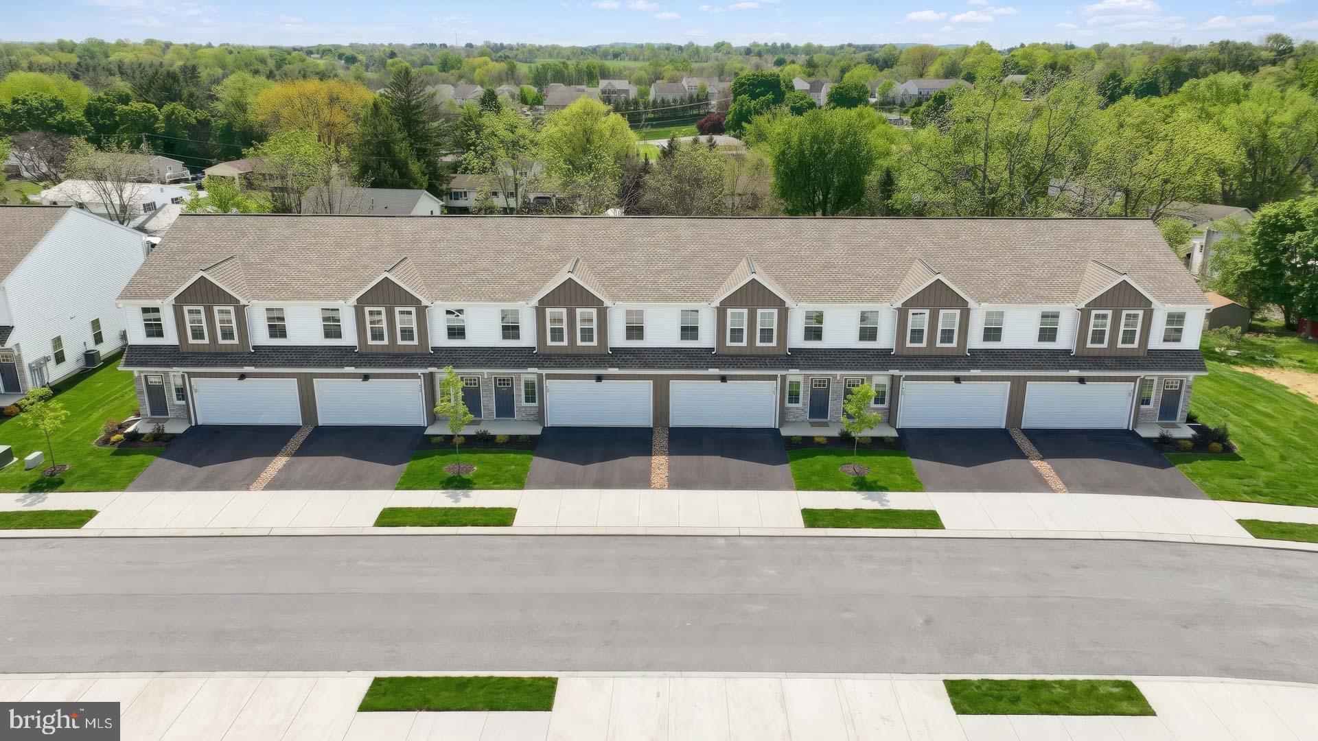 This spacious townhome is well-equipped with a 2-car garage, 9’ ceilings on the first floor, and a patio for outdoor living. The kitchen, featuring stainless steel appliances and quartz countertops with a tile backsplash, opens to the dining area and sunny family room. The 2nd floor boasts all 3 bedrooms, 2 full bathrooms, and a convenient laundry room. The owner’s suite includes an expansive closet and a private bathroom. The community is convenient to Harrisburg, Hershey, and major highways. Images may include virtual furnishings for illustrative purposes only.