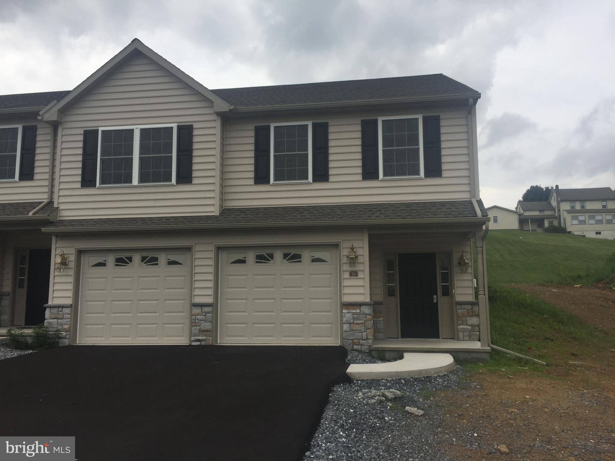 Great new floor plan for WoodsEdge.  Taxes are based on lot only. WoodsEdge is a quiet small community just outside of town. No mow and snow. Home is complete and easy to show.