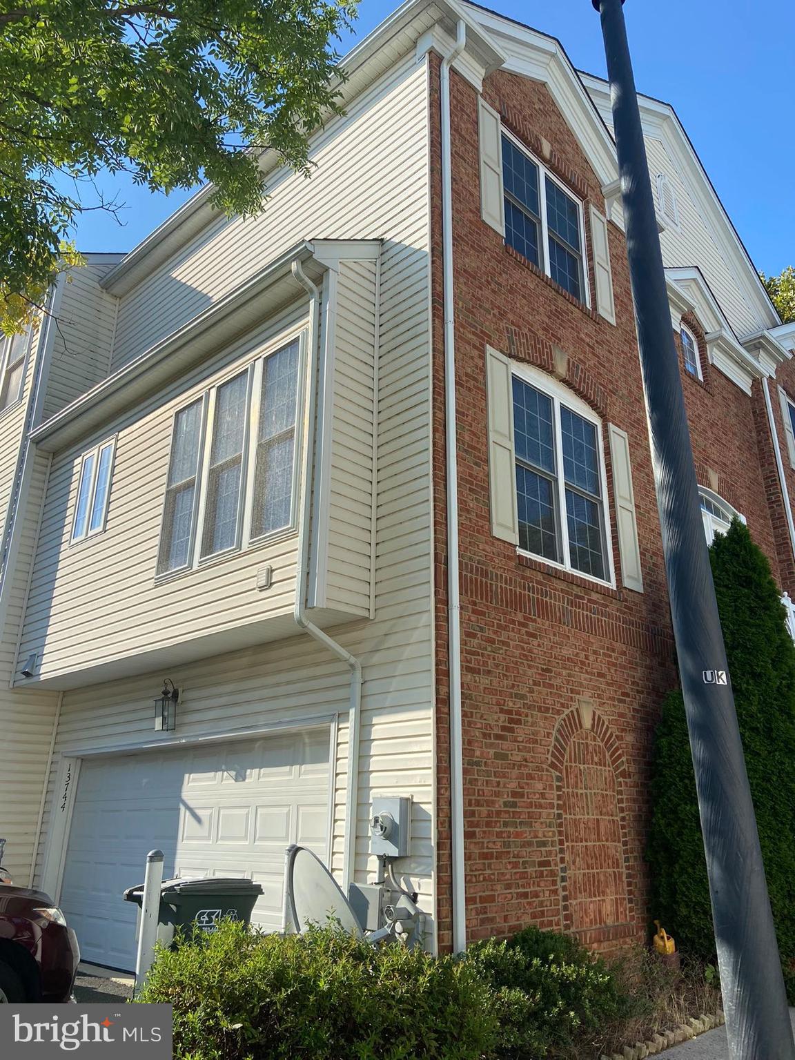 Brick front End unit  with 2-car garage in upscale area of Herndon/Dulles tech corridor. The open floor plan lets in abundant natural light on all floors. Beautiful laminate floor on all three levels;  kitchen w/ granite counters and SS appliances. The upper level offers 3 bedrooms to include the master bedroom with a beautiful tray ceiling and en-suite bath complete with a soaking tub, stand-up shower and double vanities.  Lower level office can be used as a 4th bedroom with a half bath.  Ceramic tile in the kitchen, bump-out breakfast area. Kitchen w/ granite Counter, upgraded cabinet, and SS appliances. Less than 3 miles from future Herndon-Monroe metro station and toll road, close to restaurants, entertainment and etc.