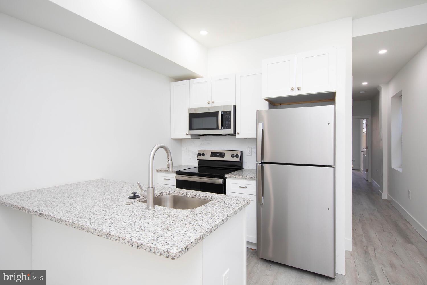 This beautifully renovated  2-bedroom, 2-bathroom with modern amenities offers a cozy yet spacious layout, ideal for anyone looking for a comfortable city retreat. Step inside to find a light-filled, open living space featuring high ceilings, large windows, and wood floors. The galley style kitchen features plenty of counter space, custom cabinetry,  and stainless steel appliances. Each bedroom is a  tastefully updated private retreat with In-suite bathrooms. You’re just minutes away from bustling Lancaster Ave and lined with cafes, restaurants, and shops.  Easy access to University City and Center City, make this home as convenient as it is beautiful.
