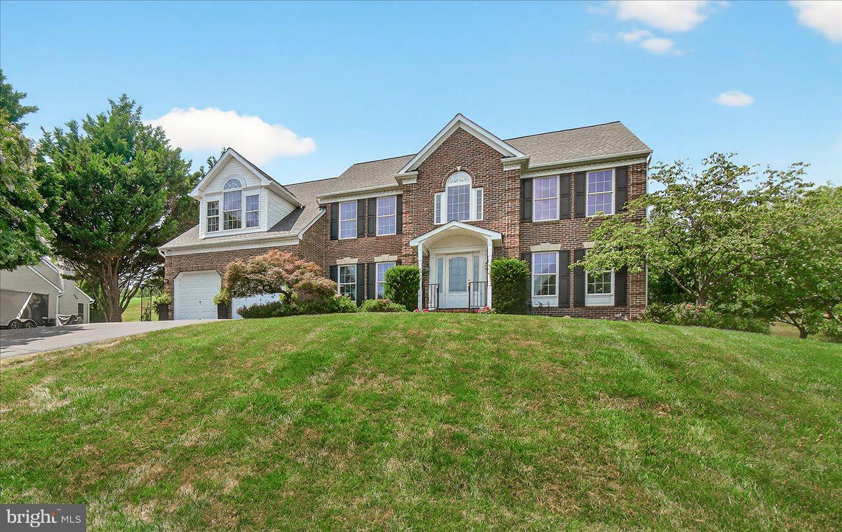 Welcome to the Highly Sought-After Community of Samhill Estates!
Nestled in an established, tree-lined neighborhood known for its quiet streets and welcoming community, this exceptional property offers a rare blend of privacy, convenience, and everyday comfort. Perched on a gentle hill, the home enjoys refreshing natural breezes and a peaceful, retreat-like setting—ideal for today’s hybrid or remote lifestyle. Perfectly located between Washington, Baltimore, and BWI Airport, this home offers both serenity and accessibility.
This stunning, meticulously maintained Colonial showcases over 5,200 square feet of beautifully designed living space—one of the largest homes in the neighborhood. Designed with both entertaining and daily living in mind, the outdoor spaces are truly special, featuring a sun-drenched sunroom, a screened-in porch with a vaulted wood ceiling, a spacious Trex deck, and a patio perfect for gatherings.  
Step inside to a grand two-story foyer highlighted by a graceful curved staircase and gleaming hardwood floors. The main level offers a formal living room and an elegant dining room with crown molding—perfect for hosting memorable dinners.
At the heart of the home is the newly renovated custom eat-in kitchen, complete with:
Stainless steel appliances; Leathered granite countertops; Subway tile backsplash; Center island with pendant lighting; Oversized coffee/wine bar with gray brick tile; Wine refrigerator and large pantry.
The kitchen flows seamlessly into a dramatic two-story family room filled with natural light and anchored by a cozy gas fireplace.  Also on the main level:  Private office/library with built-ins (ideal as a 5th bedroom)
Powder room; Laundry room with utility sink and cabinetry; Interior access to a two-car garage
Upstairs, retreat to the luxurious primary suite featuring:  Private sitting area; Expansive walk-in dressing room with built-in storage; Spa-inspired en-suite bath with soaking tub and separate shower.  Three additional generously sized bedrooms share an updated full bath with double vanity.
The fully finished walk-up basement expands your living space with  Second family/recreation room
Wet bar; Flexible hobby or fitness area; Full bath; Direct backyard access
A truly unique highlight is the elevated observation deck at the top of the hill—complete with electricity and ethernet—perfect for stargazing, relaxing, or working outdoors.
Additional peace of mind comes with a natural gas whole-house generator, ensuring comfort during any weather.
Located in the vibrant Mount Airy area, Samhill Estates offers easy access to local wineries, distilleries, parks, and dining.  This is more than a home—it’s a lifestyle.  Don’t miss the opportunity to own a property that truly has it all: space, style, and an unbeatable location.