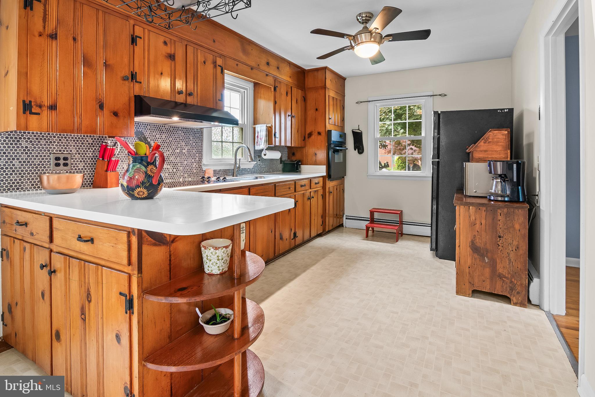 Discover the charm of this delightful bungalow nestled in the heart of Centreville Heights. This beautifully maintained 2-bedroom, 1-bathroom home boasts hardwood floors that flow seamlessly throughout, creating a warm and inviting atmosphere. The eat-in kitchen is perfect for those early morning coffees or evening cocktails, including a cooktop, wall oven, dishwasher, and refrigerator, perfect for culinary enthusiasts. Step outside to enjoy your private deck, ideal for enjoy those beatiful mornings or evening gatherings. The spacious lot offers ample outdoor space, complemented by street lights that enhance the neighborhood's inviting ambiance. A convenient shed provides additional storage for your gardening tools or outdoor equipment. The interior features include an attic for extra storage, a cozy dining area, and energy-efficient double-hung windows that fill the home with natural light. The basement, equipped with a drainage system and sump pump, offers potential for additional living space or a workshop. Located in a vibrant community, this home is just minutes away from local parks, providing endless opportunities for outdoor activities and relaxation. The neighborhood is known for its friendly atmosphere and accessibility to essential public services. This property is not just a house; it's a place to create lasting memories. Embrace the lifestyle you've always wanted in Centreville Heights!