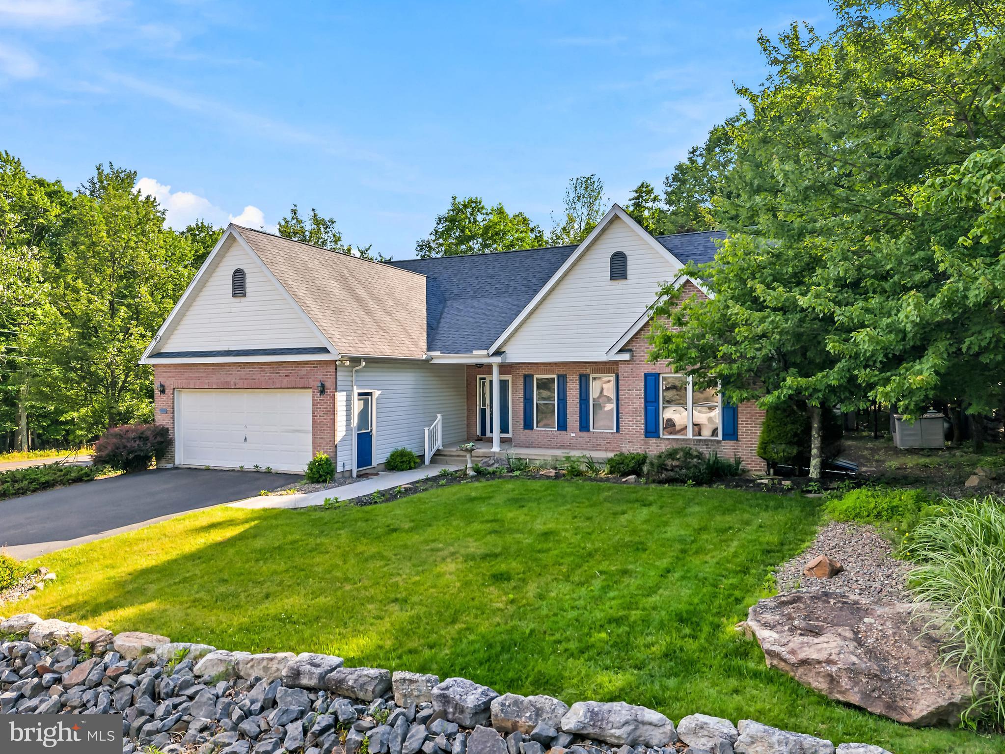 Welcome to a truly breathtaking country club-style gated community, a one-of-a-kind living experience. Tucked away from the hustle of the busy workday, you'll discover what is often said to be one of Pennsylvania's greatest secrets, Eagle Rock Resorts. This amazing all-in-one community offers its residents not only a championship golf course but also outdoor and indoor aquatic facilities, an equestrian area and stables, winter sports, lakes for fishing and boating, and exceptional dining, along with much more. Posied amongst all of this, you will find this beautiful ranch home offers a sprawling master retreat with a massive ensuite and sitting area, plus two additional nicely-sized bedrooms—all on the first floor. The expansive living room features soaring 17-foot-plus ceilings and a cozy gas fireplace, while a bonus loft and additional storage provide even more versatility.
You'll love the tons of extra finished space in the basement, currently enjoyed as a rec room with pool and ping pong tables, along with a wood-burning stove. Need more room? There's another finished room perfect for a bedroom or office downstairs, along with a third half bath and an unfinished workshop area.
Love the outdoors? The two-tiered composite deck is perfect for sipping your morning coffee or entertaining while you BBQ your favorite meals to share. With this home and all the amenities this community has to offer, you won't want to miss this opportunity!