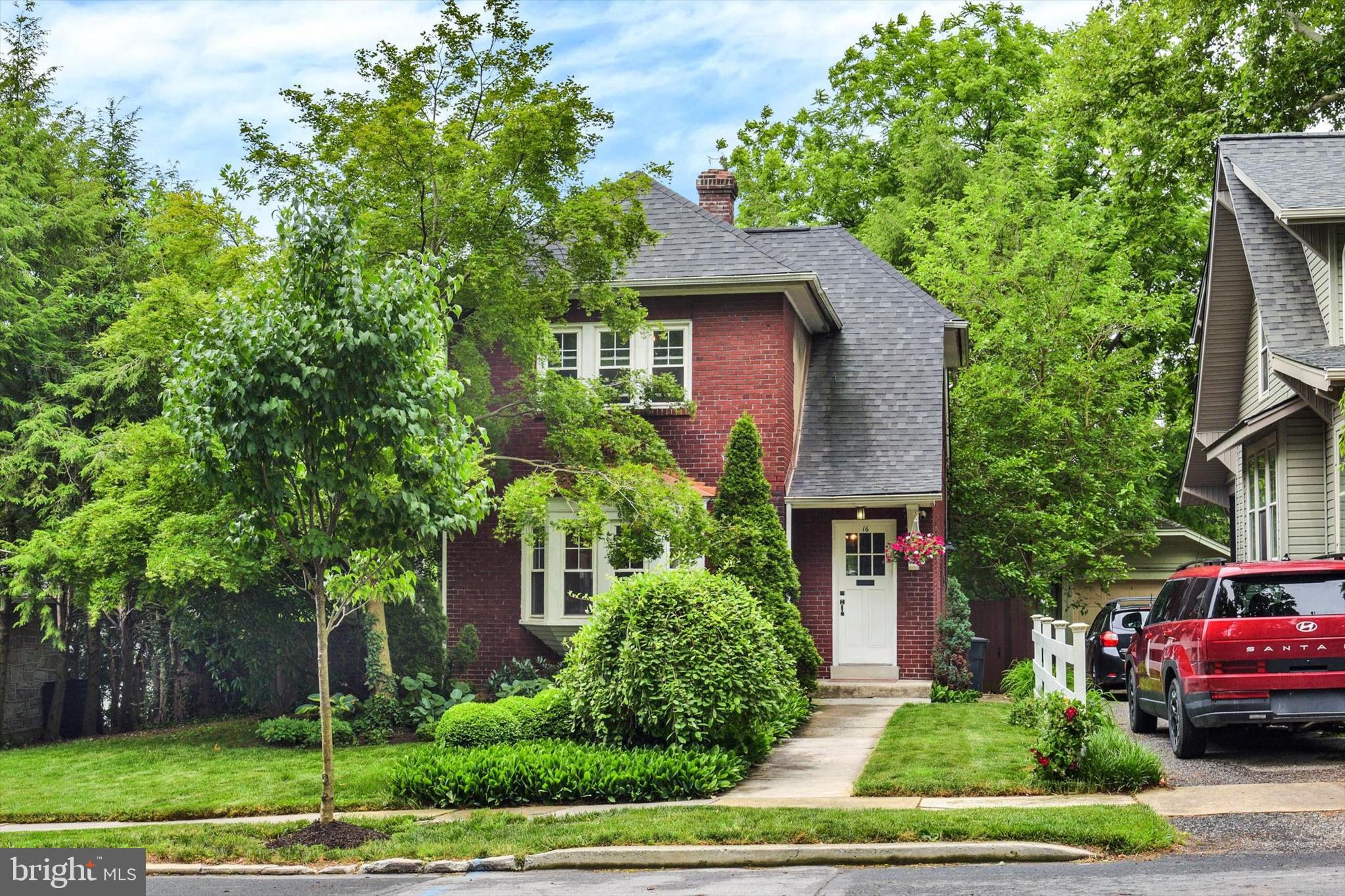 Welcome to 16 N 27th Street — a charming brick cottage nestled on a picturesque tree-lined street in the heart of Camp Hill. Built in 1927, this beautifully maintained home blends timeless character with thoughtful modern updates throughout its approximately 1,372 square feet of living space. Featuring 2 bedrooms and 1 ½  baths, this inviting property offers warm hardwood flooring, abundant closet space, and a partially finished basement for additional flexibility.
Step outside and enjoy the private fenced rear yard complete with patios, mature landscaping, and a storage shed — ideal for relaxing summer evenings or hosting guests. The charming side porch adds even more outdoor living space and enhances the home’s classic curb appeal. Conveniently located near local dining, shopping, parks, and within the desirable Camp Hill School District, this home offers a rare opportunity to own a character-filled property in one of the area’s most sought-after neighborhoods. A joy to show!