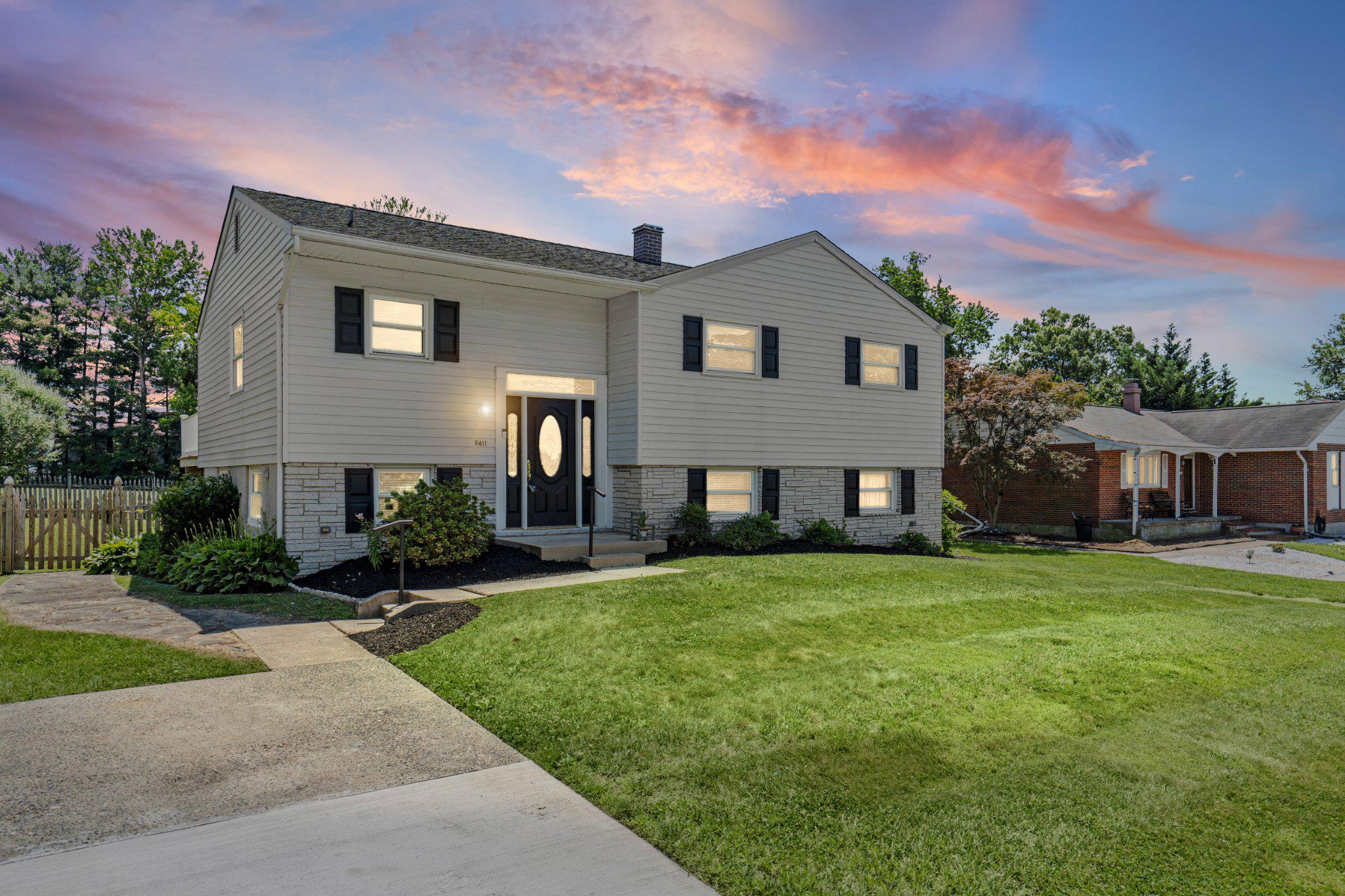 Nestled on a quiet dead-end street in the highly desirable Chapel Manor community, this impeccably maintained four-bedroom, two-full-bath single-family home offers the perfect combination of privacy, comfort, and an exceptional setting. Backing to a sprawling open common area, this premium homesite delivers the backyard you've been searching for with room to relax, entertain, and enjoy the peaceful surroundings. A convenient two-car parking pad adds to the home's everyday appeal.

Step inside through the welcoming ceramic tile foyer and into a bright, open main level designed for effortless everyday living. Gleaming hardwood floors flow throughout the spacious family room and adjoining dining area, while French doors seamlessly connect the interior to the rear composite deck, creating the perfect space for entertaining both inside and out. The well-appointed kitchen features durable LVP flooring, updated black stainless steel appliances, abundant cabinetry, and a convenient pass-through overlooking the dining area.

The main level also offers three generously sized bedrooms, each complete with hardwood flooring and ceiling fans, along with an updated full bathroom featuring dual vanities.

The fully finished lower level provides an incredible amount of additional living space with a massive recreation room showcasing durable LVP flooring and walkout access to the partially covered rear patio. A spacious fourth bedroom, dedicated home office, second full bathroom, and separate laundry and utility room offer endless flexibility to fit your lifestyle.

The outdoor living spaces are just as impressive. Enjoy morning coffee or summer cookouts on the composite rear deck overlooking the fully fenced backyard, then unwind on the partially covered patio below. Beyond the fence lies a beautiful open common area, providing an expansive backdrop and a sense of privacy that's rarely available in such a convenient location. Fresh neutral paint throughout, an updated architectural shingle roof, and an updated HVAC system provide peace of mind for years to come. Ideally located just minutes from shopping, dining, parks, schools, and major commuter routes, this move-in-ready Chapel Manor gem truly checks all the boxes.