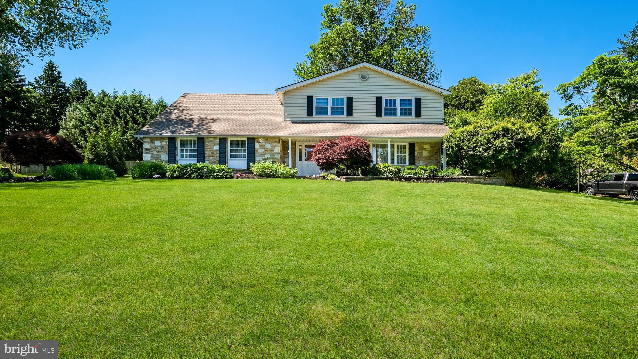 Welcome to this 3,500 square foot,  five-bedroom home nestled on a beautifully landscaped lot in Justa Farms located in the  highly desirable Lower Moreland School System. A dramatic spiral staircase creates an impressive first impression as you enter the foyer. The formal living room features a large picture window that fills the space with natural light and a cozy fireplace, while the adjoining dining room offers the perfect setting for holiday gatherings and entertaining.  The chef's kitchen is designed for both everyday living and special occasions, featuring abundant cabinetry, generous counter space, and a pantry for added storage. Just off the kitchen, the inviting family room offers a second fireplace and picturesque views of the lush backyard. A versatile fifth bedroom on the main level can also serve as a private home office, guest room, or study. Completing the first floor are a convenient powder room and laundry room.
Upstairs, the spacious landing leads to the primary suite, featuring a dedicated makeup area and an en-suite bathroom. Three additional generously sized bedrooms and a full hall bathroom with a tub provide plenty of space for family and guests. The expansive unfinished basement offers endless possibilities to create additional living space, whether you envision a recreation room, home gym, office, or media room.
Step outside to the covered patio and enjoy the peaceful backyard retreat. With mature landscaping and ample space for outdoor games, gardening, entertaining, or simply relaxing, this backyard is ready to
become your personal oasis.  This wonderful home offers hardwood floors, 3 zoned heating, 2 zoned air conditioning and a 2 car garage with heat.   Enjoy the space, comfort, and flexibility both inside and out—an exceptional opportunity in a sought-after location.  Walk to Justa Farm Park, Mason Mill Park and Pennypack trail.   Conveniently located near shopping, trains and major roadways.