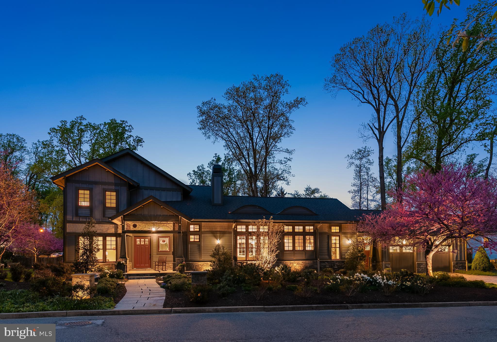 Step into a one-of-a-kind architectural masterpiece where Arts & Crafts design seamlessly blends with the elegance of Art Nouveau interiors. This 4-bedroom home, featuring a main-level primary suite, is a stunning fusion of organic movement, intricate craftsmanship, and modern sophistication. Built in 2015, the home showcases thoughtful design at every turn. Art Nouveau influence is evident throughout—from the hand-carved wood banister and mosaic flooring to etched glass details and ornate iron railings, each element reflecting the graceful, asymmetrical flow of this timeless style. At the heart of the home is a gourmet kitchen that opens to a warm and inviting Great Room, complete with a grand fireplace, custom built-ins, and beamed ceiling. The  kitchen features an artistic backsplash inspired by Victor Horta, a mahogany island custom-designed by Cory Hill, a 1936 Parisian Art Deco lighting fixture, and polished granite countertops. Beyond the grand foyer—where intricate mosaic flooring by Cory Hill and the “Rose Woman” stained glass window artist Pamela Bogdonoff leave a lasting impression—you’ll find a beautifully appointed library or office. The luxurious primary suite overlooks the lush backyard and pool, offering privacy and tranquility with a spa-like bath, heated floors, custom walk-in closet, and brand-new carpet (2025).  Upstairs, you’ll find two spacious ensuite bedrooms and a versatile bonus room—perfect as a private office, creative space, or teen lounge. The lower level offers flexible living with a recreation room, au pair suite, or guest quarters. Outside, a wraparound yard, manicured landscaping, and a breathtaking geothermal-heated pool with hot tub and charming gazebo create a private outdoor sanctuary rarely found in the DMV. Located in Falls Church City, less than 10 miles from D.C., this home offers seamless access to Reagan National and Dulles airports and major commuter routes. Additional highlights include geothermal heating/cooling throughout the home, a generator, and an oversized, heated garage.