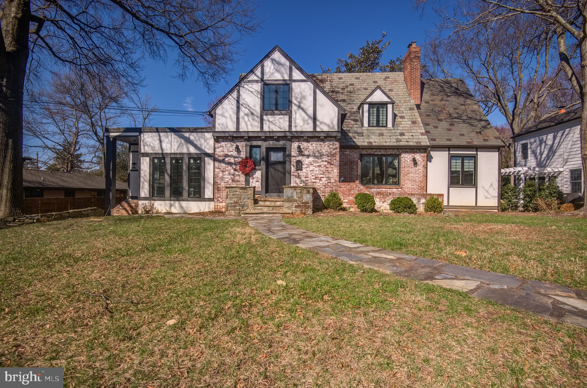 OPEN HOUSE SAT 4/4 1-4PM!!     Motivated seller!  Ready for your offer!!  Come discover the irresistible charm and modern luxury of this beautifully reimagined Dutch Tudor, gracefully set on a large, maturely landscaped lot in Alexandria City’s sought-after Clover/College Park neighborhood. From the moment you arrive, the home’s storybook exterior captures your attention—where timeless architecture meets meticulous, top-to-bottom renovation.

At 406 Yale, every detail has been thoughtfully curated through a complete “down-to-the-studs” transformation in 2021.  With over 3,800 square feet of refined living space, this residence has been entirely rebuilt for today’s lifestyle, featuring all-new systems, electrical, plumbing, insulation, ductwork, and high-end finishes throughout. The result is a seamless blend of historic character and contemporary sophistication—truly move-in ready and designed to impress.

The exterior sets the tone with a striking slate roof, bold new color palette, sleek black windows, and updated doors. Meandering stone walkways, elegant brick retaining walls, and lush, mature landscaping create a sense of privacy and tranquility, while a Brazilian Ipe deck and four-board fencing provide the perfect backdrop for outdoor living and entertaining.

Inside, the main level unfolds with effortless flow and versatility. Sunlight pours into the expansive family room and generous dining area, both thoughtfully connected to a bright solarium that bridges indoor and outdoor living. At the heart of the home, a custom chef’s kitchen shines with professional-grade KitchenAid appliances—including a gas range, refrigerator, dishwasher, and microwave/oven combo—complemented by a charming banquette and abundant storage. The adjoining family room, anchored by a cozy gas fireplace and enhanced with recessed LED lighting, offers a warm and inviting space to gather, with easy access to the flat, spacious backyard.

The main level also features a private en-suite bedroom—ideal for guests or multi-generational living—along with a stylish powder room.

Upstairs, the home continues to impress with a serene and spacious primary suite designed as a personal retreat. Enjoy a spa-inspired en-suite bath and a large walk-in closet, along with a dedicated office or reading room that adds flexibility for work or relaxation. An additional bedroom with its own en-suite bath completes the upper level, offering comfort and privacy for family or guests.

The fully finished lower level expands the home’s versatility even further. With both indoor and outdoor access, it includes a temperature-controlled garage (ready for EV charging), a media or exercise room, a fourth bedroom with full en-suite bath, and a laundry room—perfect for everyday convenience.

Blending the craftsmanship of 1930 with the innovations of today, this home stands as a rare and remarkable offering. Set on a quiet, tree-lined street, it provides a peaceful retreat just minutes from shopping, dining, Old Town Alexandria, the Pentagon, Washington, D.C., and Amazon’s headquarters. With easy access to Duke Street, I-395, and just 1.5 miles to King Street Metro and VRE, convenience is always within reach.

This is more than a home—it’s a one-of-a-kind lifestyle opportunity where timeless charm and modern living come together in perfect harmony.