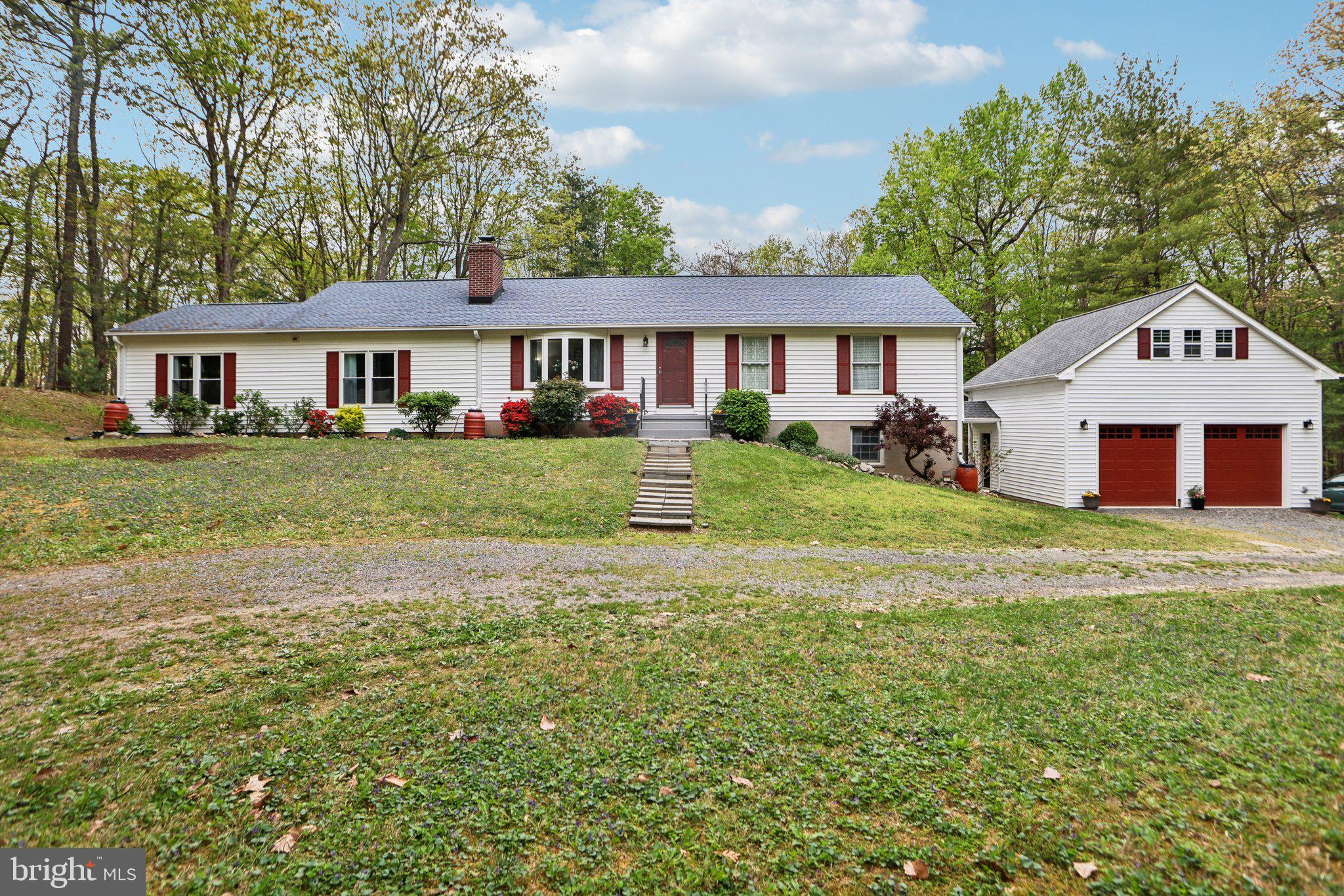 Sellers are requesting an offer deadline for 8 PM Tuesday, April 29,2025.  Please submit your highest and best by the deadline. All offers will be reviewed and a decision will be made on Wednesday, April 30,2025.  Please submit offer in one pdf. to listing agent.  Welcome to this stunning 4-bedroom, 2-bath rambler in Fauquier County’s desirable MountJoy Estates—offering over 3,300 square feet of beautifully updated living space on two levels, all set on 12 wooded acres with four natural springs and private trails.

The main level showcases timeless hardwood floors and a spacious living room with a bow bay window. A HUGE family room—perfect for gatherings—features a gas fireplace, hardwood flooring, and a ceiling fan, and opens into the formal dining room, which is bright and also equipped with a ceiling fan. The dining room walks out to the rear patio featuring a Portico. Off the family room, you’ll also find a cozy sitting area/library.

The remodeled gourmet kitchen is sure to impress with a sunny breakfast area, stainless steel appliances including a refrigerator with bottom freezer, range with canopy hood, dishwasher, microwave, and a deep stainless steel farm sink. Granite countertops and a custom backsplash add the finishing touches. French doors lead out to the deck—perfect for outdoor entertaining.

This home features three fireplaces (gas, wood stove, and insert), multiple ceiling fans, and plenty of recessed lighting, adding charm and comfort throughout. The main level also includes three generous bedrooms filled with natural light, including a primary suite with an en-suite bathroom and an additional updated hall bath.

Downstairs, the full basement offers additional living space with a large recreation/sitting room featuring a cozy wood-burning stove, the 4th bedroom, and a spacious laundry/storage room.

From the basement walkout, access the breezeway leading to an oversized 2-car garage with an unfinished loft—ideal for a future guest apartment, home office, or studio.

Notable updates include:
HVAC (2021)
Hot water heater (2022)
Windows & doors (2018)
Roof (2015)

A rare find that blends modern upgrades with tranquil, country living—just minutes from amenities and major routes. Don’t miss your opportunity to own a slice of Virginia paradise!