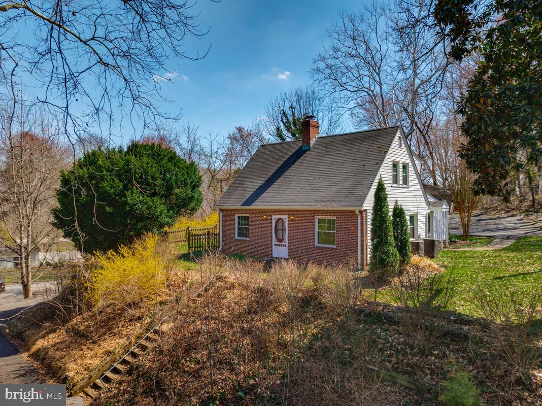 VA assumable loan opportunity with an approximate 4.9% interest rate for qualified VA buyers.
Charming two-story Cape cod home with finished basement in a prime La Plata location, featuring a HUGE detached cinder block garage, circular driveway, and extensive parking. Set back off the road on a hill, this property offers privacy while still being close to shopping, dining, and commuter routes. The updated kitchen includes stainless steel appliances, cabinets, countertops, tile flooring, and a tile backsplash. Main level offers hardwood floors, a wood stove, two separate living spaces, a bedroom, and a full bath. Upper level features two bedrooms, a full bath, and ample storage. The finished basement includes a family room, half bath, and laundry area. Enjoy outdoor living on the screened-in porch overlooking the spacious lot. Convenient to NAS Patuxent River, Joint Base Andrews, Joint Base Bolling, NSWC Indian Head, NSWC Dahlgren, and major commuter routes to DC and Virginia. Close to University of Maryland Charles Regional Medical Center, parks, trails, shopping, and restaurants. NO HOA.