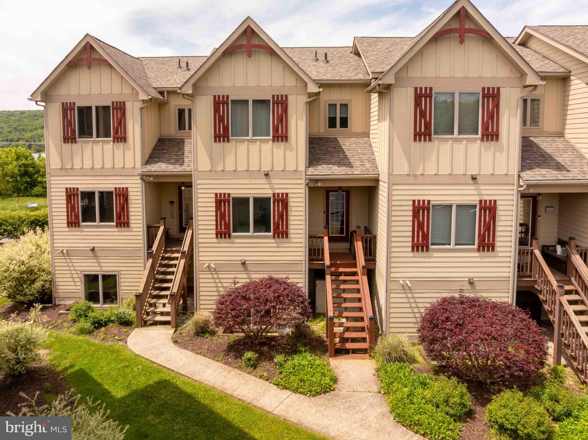 Welcome to this beautifully updated modern townhome in the heart of Mc Henry, offering stunning views of Deep Creek Lake and Wisp Resort. Thoughtfully designed for comfort, convenience, and entertaining, this spacious 4-bedroom, 3-bath home is the perfect mountain retreat or year-round residence.

The main level features an open-concept floor plan with a stylish kitchen, dining area, and inviting living room that flows seamlessly onto a private deck overlooking the surrounding scenery. A large flat-screen TV, outdoor dining table, chairs, and grilling area make entertaining effortless.

With two separate living spaces, there's plenty of room for family and guests to relax. The lower-level family room features a cozy fireplace, additional flat-screen TV, and direct access to the outdoor hot tub. A privacy fence creates the perfect setting for unwinding after a day on the lake or the slopes.

Each bedroom is spacious and welcoming, and the home's professional staging highlights its warm, comfortable atmosphere throughout. 

Located just minutes from skiing, golfing, restaurants, shopping, marinas, and all that Deep Creek Lake has to offer, this move-in-ready townhome combines modern style with mountain-lake living at its finest.