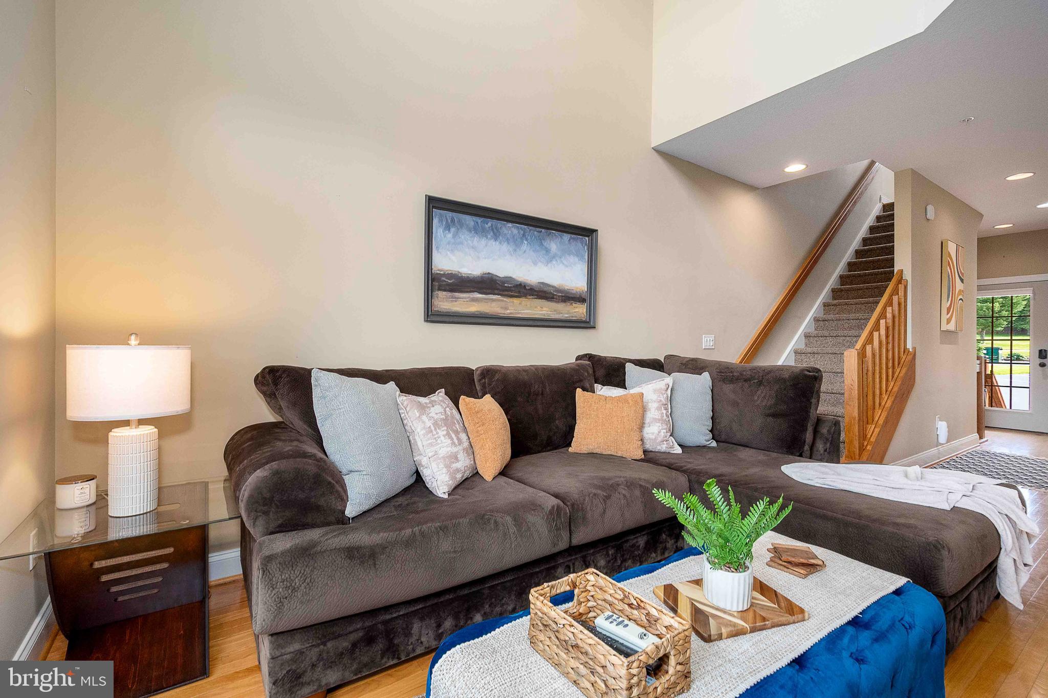 Welcome to this beautifully updated modern townhome in the heart of Mc Henry, offering stunning views of Deep Creek Lake and Wisp Resort. Thoughtfully designed for comfort, convenience, and entertaining, this spacious 4-bedroom, 3-bath home is the perfect mountain retreat or year-round residence.

The main level features an open-concept floor plan with a stylish kitchen, dining area, and inviting living room that flows seamlessly onto a private deck overlooking the surrounding scenery. A large flat-screen TV, outdoor dining table, chairs, and grilling area make entertaining effortless.

With two separate living spaces, there's plenty of room for family and guests to relax. The lower-level family room features a cozy fireplace, additional flat-screen TV, and direct access to the outdoor hot tub. A privacy fence creates the perfect setting for unwinding after a day on the lake or the slopes.

Each bedroom is spacious and welcoming, and the home's professional staging highlights its warm, comfortable atmosphere throughout. 

Located just minutes from skiing, golfing, restaurants, shopping, marinas, and all that Deep Creek Lake has to offer, this move-in-ready townhome combines modern style with mountain-lake living at its finest.