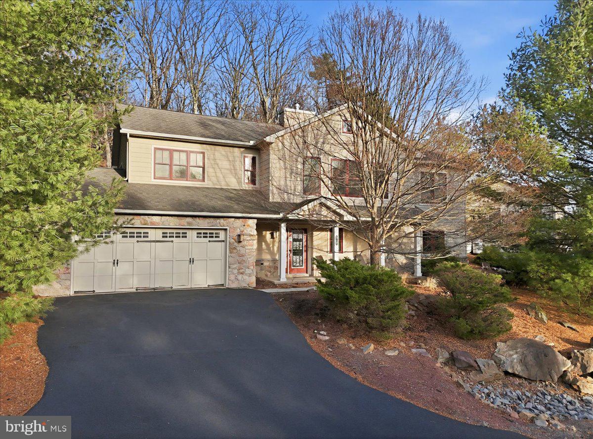 OPEN HOUSE 6/7, 11am-1pm!! Welcome to your fully furnished, turn-key mountain-lake getaway -- where unforgettable family memories and investment potential come together! This 4-bedroom, 3-full-bath home offers the perfect place to gather, relax, and enjoy everything Lake Harmony has to offer year-round. Spend your days at Boulder Lake Club enjoying the beach, pool, sports courts, kayak and boat rentals, and activities, then come home to vaulted ceilings, an open floor plan, and a cozy gas fireplace with beautiful stone accents. Brand new flooring throughout the first floor and a brand new propane tankless water heater add modern comfort and peace of mind. After skiing at nearby Big Boulder or enjoying a day at the lake, unwind on the spacious deck or soak in the private hot tub surrounded by nature. Best of all, short-term rentals are permitted -- giving you the opportunity to create lasting memories with family and friends while generating income when you're not using the home yourself. Located just minutes from Lake Harmony dining, entertainment, and outdoor recreation, this is more than a home -- it's a lifestyle investment. Turn the key and start making memories today!