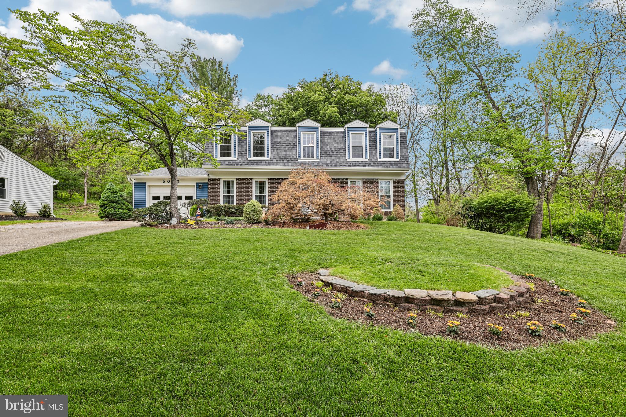 MULTIPLE OFFERS IN HAND!!!!  PLEASE SUBMIT ALL OFFERS, "BEST AND FINAL" NO ESCALATION CLAUSES BY 8:00 pm, Sunday, May 17th to Co-Listing Agent.   Don't miss out - fabulous home!!  Welcome to 5057 Ten Mills Road, a beautifully maintained 4-bedroom, 2.5-bath home offering the perfect blend of comfort, thoughtful updates, and convenience in the heart of Columbia. Nestled on a private lot backing to trees with seasonal golf course views, this home provides a peaceful retreat while remaining close to everything the area has to offer.

Step inside to a welcoming foyer flanked by a spacious living room and an elegant dining room featuring a cozy fireplace, ideal for gatherings and entertaining. The sun-filled kitchen was fully remodeled and offers ample space for cooking and everyday living, complete with a center island, breakfast nook, and updated KitchenAid appliances. Convenient interior access from the garage leads through the laundry room directly into the kitchen area for added functionality.

Upstairs, the spacious primary suite features its own private bath and generous closet space. Three additional well-sized bedrooms and a hallway bath provide flexibility for family, guests, or home office needs.

The walkout lower level is currently unfinished and offers abundant storage space, while also presenting endless potential to create additional living or entertaining areas. Whether envisioned as a recreation room, fitness space, media room, or customized retreat, the lower level provides an excellent opportunity to expand and personalize the home to fit your lifestyle.

Outdoors, enjoy the fenced backyard, mature trees, seasonal golf course views, and a composite deck with Andersen French doors that create seamless indoor-outdoor living.

This home has been meticulously updated over the years with replacement windows, siding, gutters, renovated bathrooms, HVAC system, and hot water heater. The roof features durable 50-year shingles, adding long-term value and peace of mind for years to come.

Ideally located near major commuter routes, shopping, dining, Centennial Park, and Columbia Mall, 5057 Ten Mills Road combines privacy, modern updates, and everyday convenience in one exceptional property.