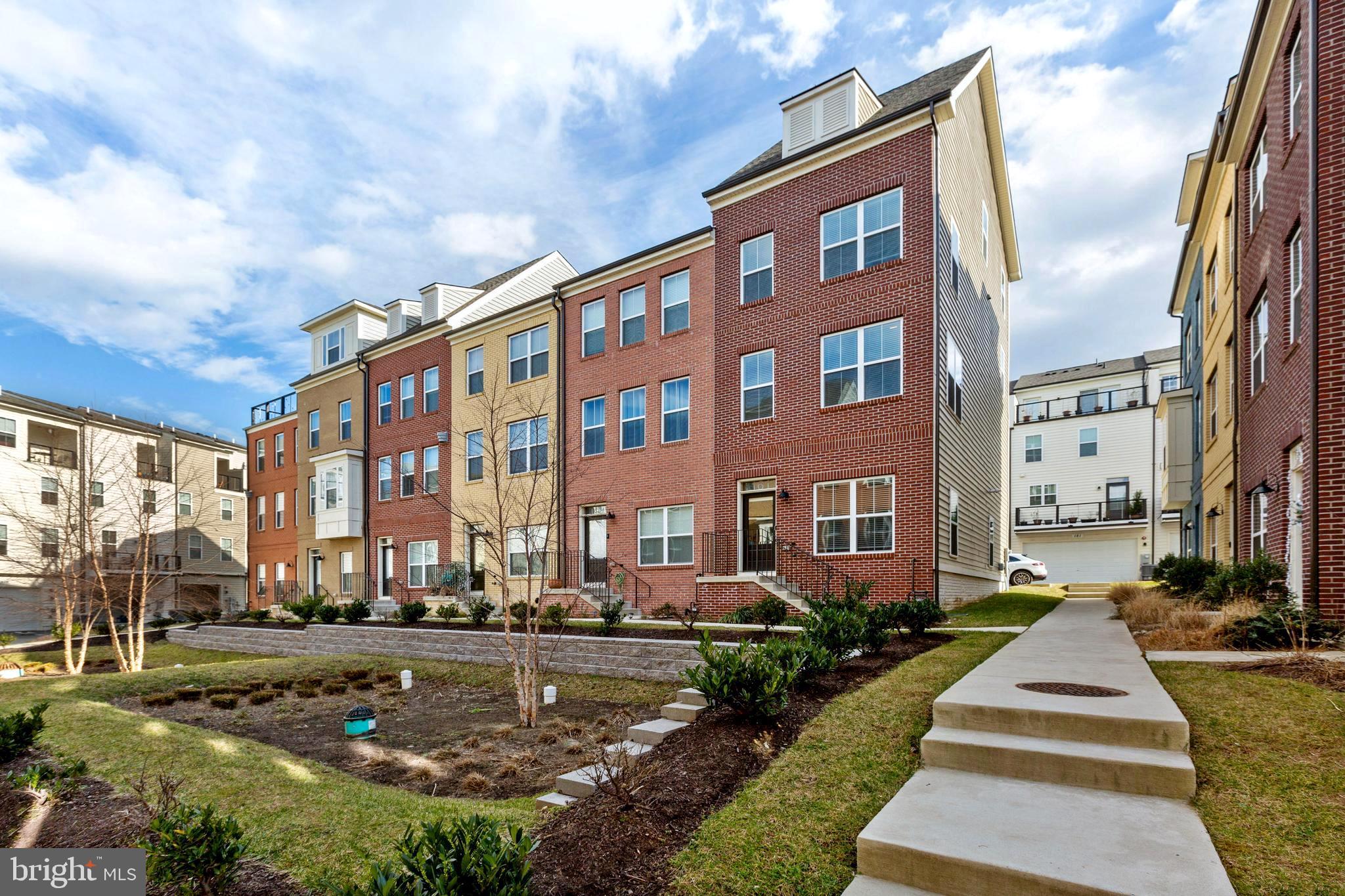Better than new construction.  Don't miss this meticulously maintained four level townhome in the heart of Glenmont MetroCentre,  just steps to the Metro and ideally located for quick access to miles of restaurants, shops and so much more.  This end-unit Winchester Home is the perfect sanctuary for modern life. Sun-filled and bright, this home has nearly every available builder upgrade in addition to numerous seller improvements.  As you enter, the at grade level is perfect for a home office, home gym or both!  The second level, main floor, boasts stunning dark hardwood floors, an open floor plan with a gourmet kitchen, stainless steel appliances, island, dual ovens, dining room, spacious living room, and a balcony off of the kitchen.  Moving up to the third floor, you will find two spacious bedrooms with like-new carpet, spacious closets and a bathroom with dual sinks.  The primary bedroom awaits you on the top floor with its own private balcony and on-suite luxurious bathroom.   Seller Improvements include; blinds in all windows, cordless blinds throughout the main level and smaller bedroom, light blocking blinds in the primary bedroom, finished/painted garage with shelving and organization rack installed, two zone temperature control, elevated outlets, motion detector in primary bathroom which triggers the water heater to prevent delays in hot water delivery, under cabinet lighting in kitchen, recessed lighting, ceiling fan rough-ins and freshly painted powder room.  Close to Matthew Hensen Trail, Wheaton Regional Park, Glenfield local Park and Brookside Botanical Gardens, this home is one you do not want to miss!