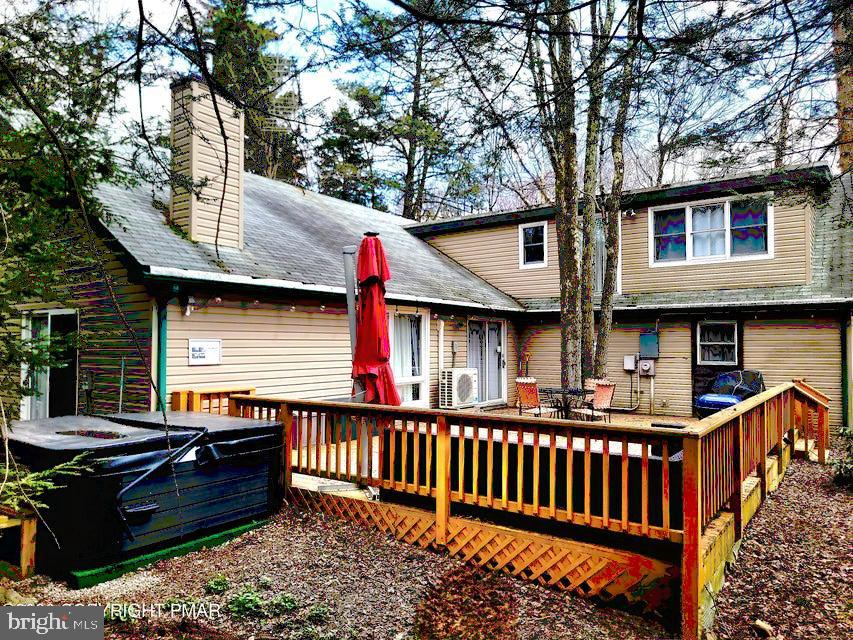 VERY UNIQUE with OPEN FLOOR PLAN located right on a GOLF COURSE and 5 minutes' walk to all the amenities. Enjoy summer days grilling and entertaining guests on a huge private deck or cozy up in a HOT TUB after a day on the slopes. Enjoy resort lifestyle in Pocono Farms Country Club with Olympic size pool, bar, restaurant overlooking Echo lake, fitness center, tennis courts, kayak club etc and tons of events for members only. Close to all Major Pocono's Attractions: Kalahari, Camelbach, Mt. Airy Casino, Shopping, Great Woof and more. Short term rental friendly. Buyers please check with township and HOA for STR requirements.