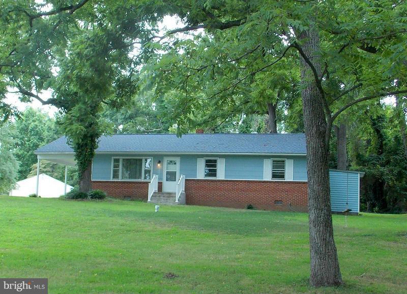 This cute waterfront home in a small community of 7 homes, is a REAL GEM!!  Major systems are updated; new roof, new well, new water heater, 5 year old furnace, new vanities, sinks and toilets in baths, new int & ext doors.  Hardwood floors throughout. Large kitchen w/ great remodeling potential. The beautiful front yard is the 2nd lot (8678 sq.ft) for a total of .71 acres at this price. Pier too!